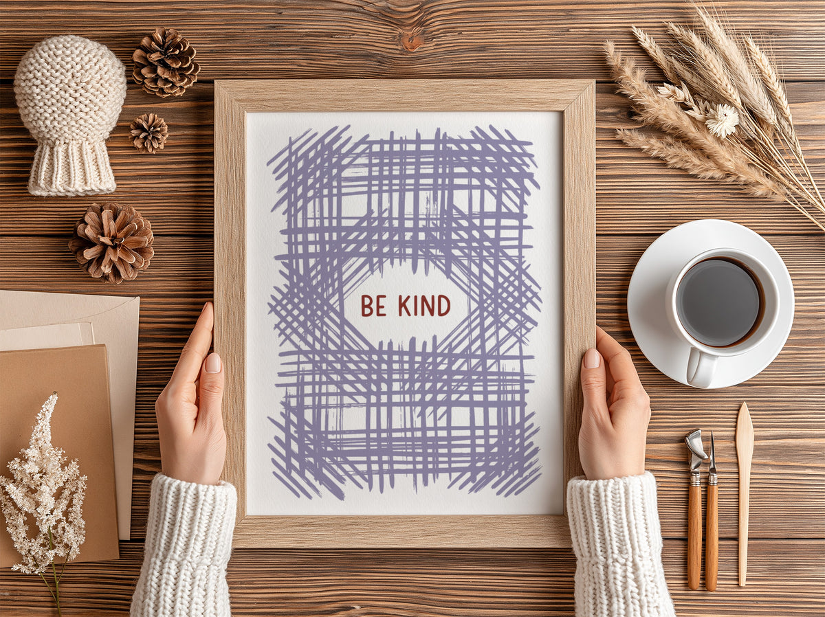 Motivational poster with Be Kind text centered over a soft lavender crosshatch pattern.