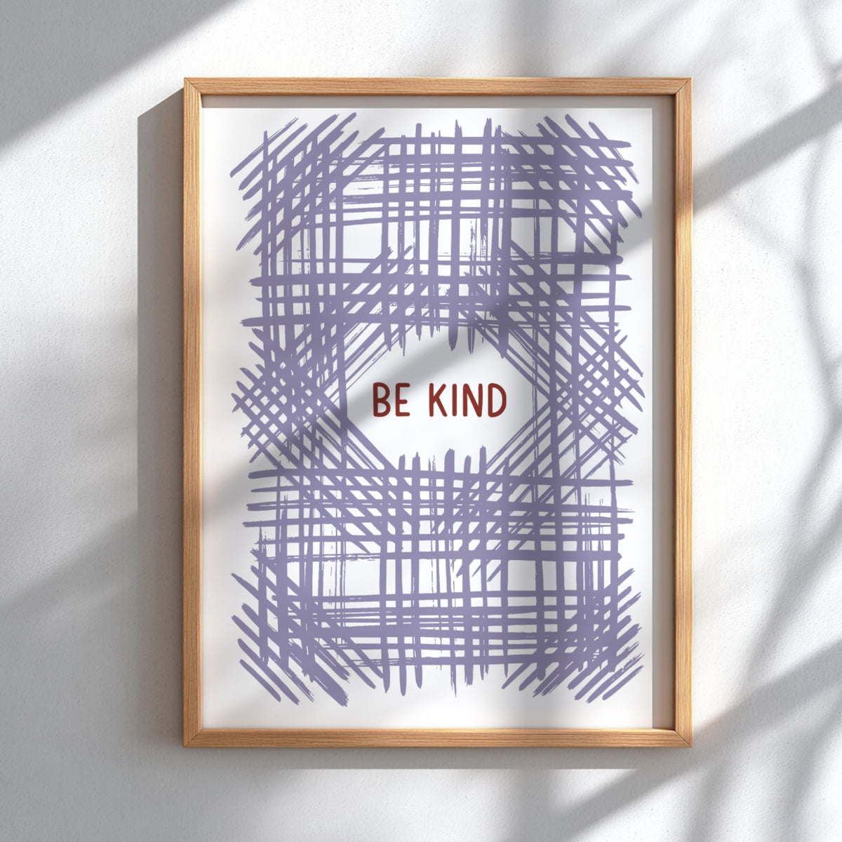Motivational poster with Be Kind text centered over a soft lavender crosshatch pattern.