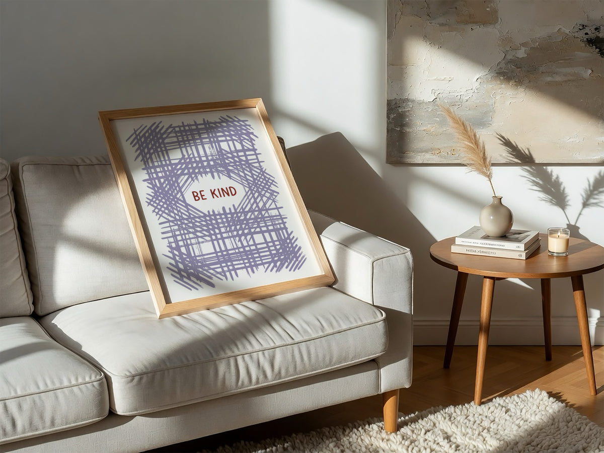 Motivational poster with Be Kind text centered over a soft lavender crosshatch pattern.