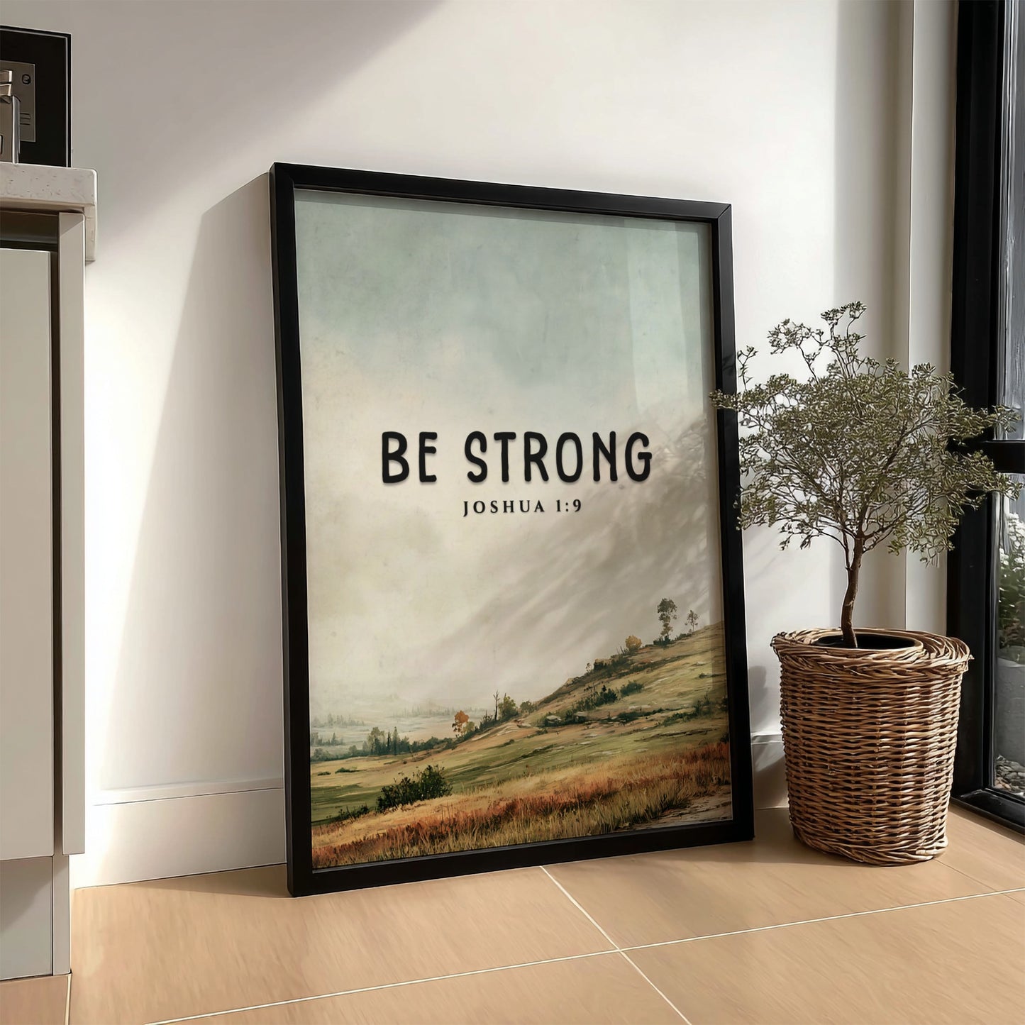 Be Strong poster featuring a serene landscape and inspirational message from Joshua 1:9 in soft greens and