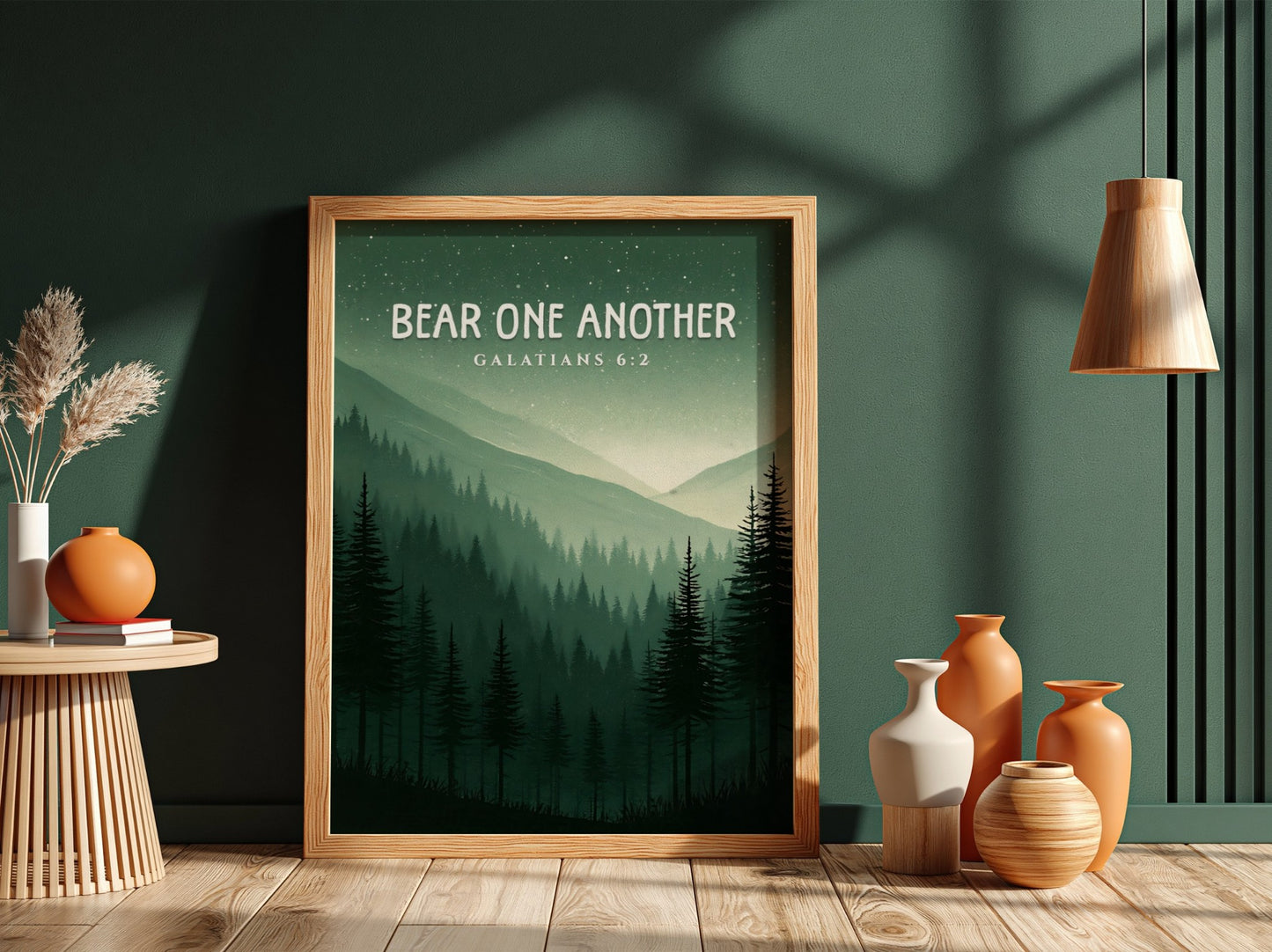 Bear One Another poster featuring a serene forest landscape with Galatians 6:2 verse in calming green tones.