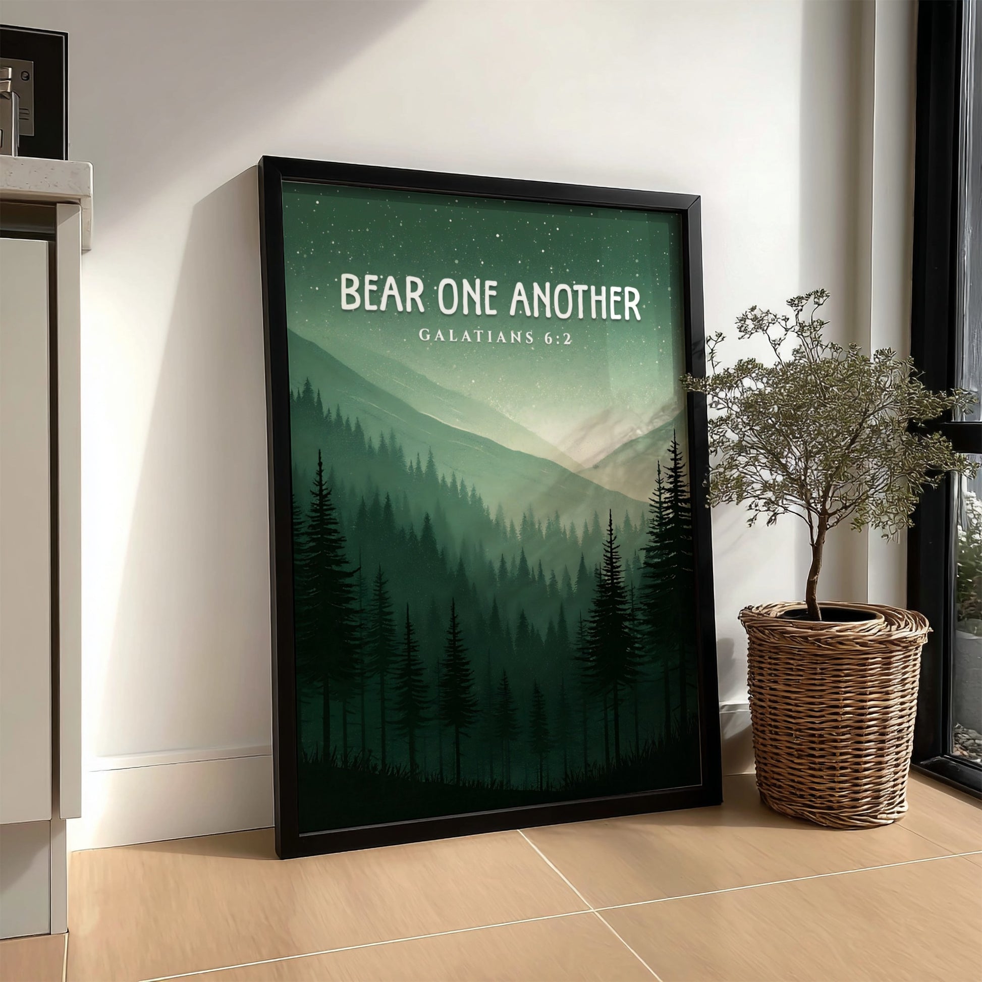Bear One Another poster featuring a serene forest landscape with Galatians 6:2 verse in calming green tones.