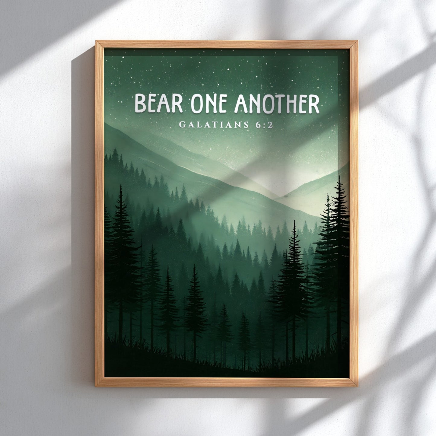 Bear One Another poster featuring a serene forest landscape with Galatians 6:2 verse in calming green tones.