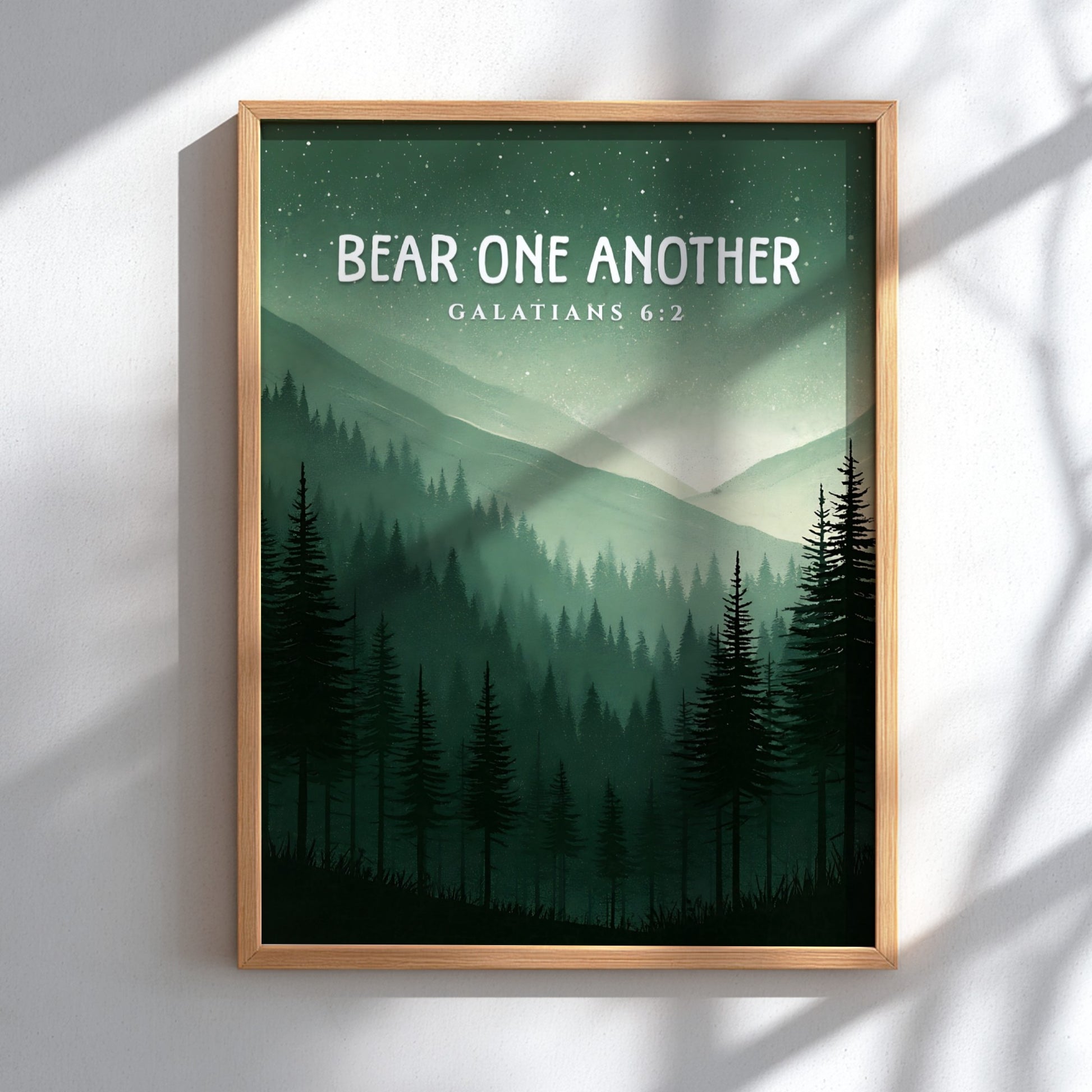 Bear One Another poster featuring a serene forest landscape with Galatians 6:2 verse in calming green tones.