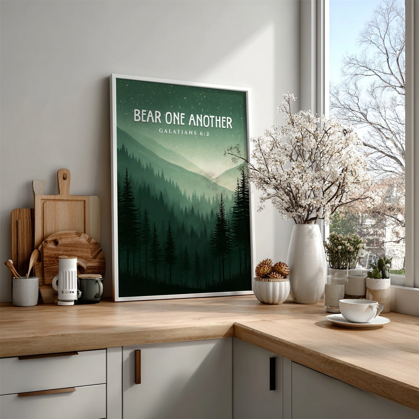 Bear One Another poster featuring a serene forest landscape with Galatians 6:2 verse in calming green tones.