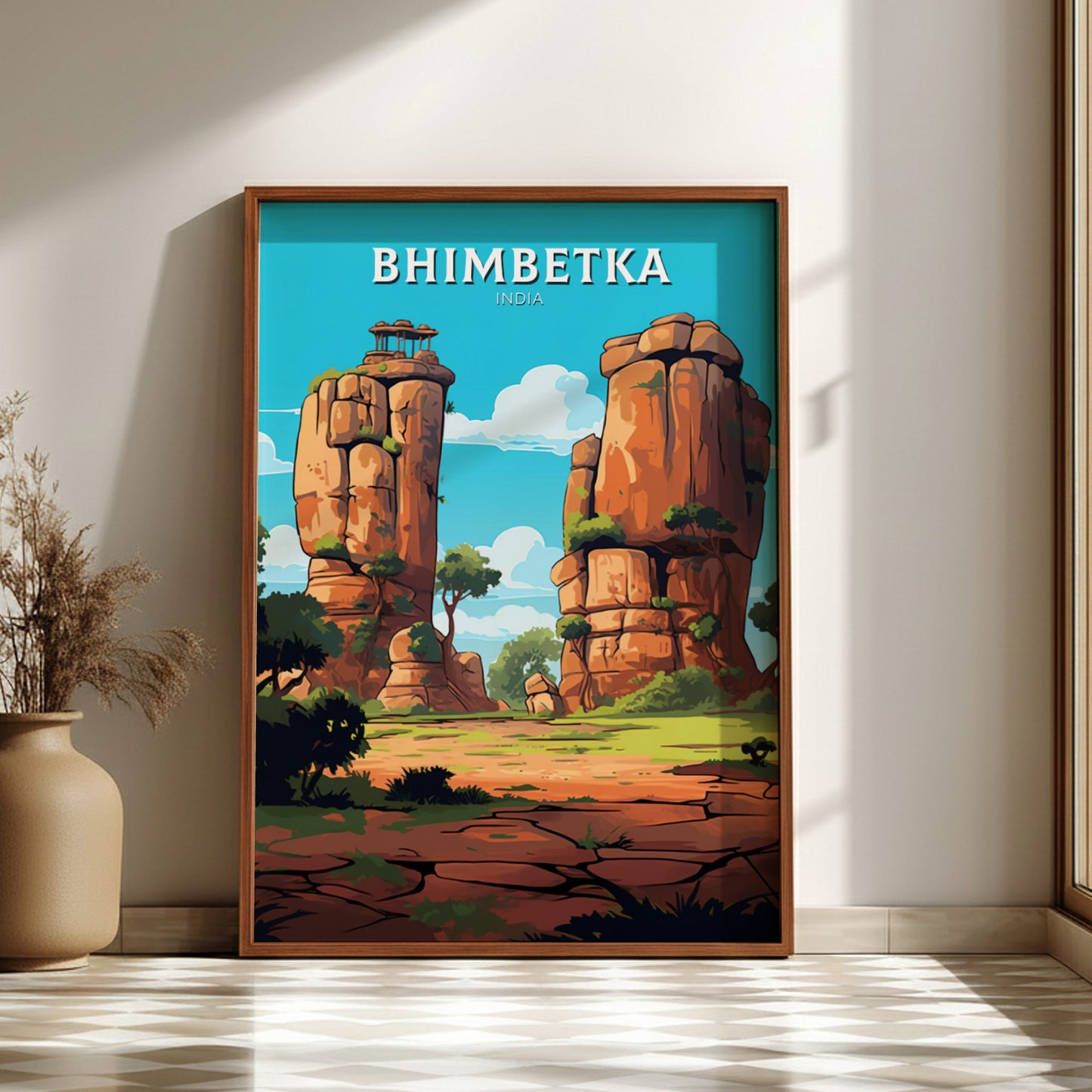 Framed artwork of Bhimbetka with rocky formations and trees on a wall.