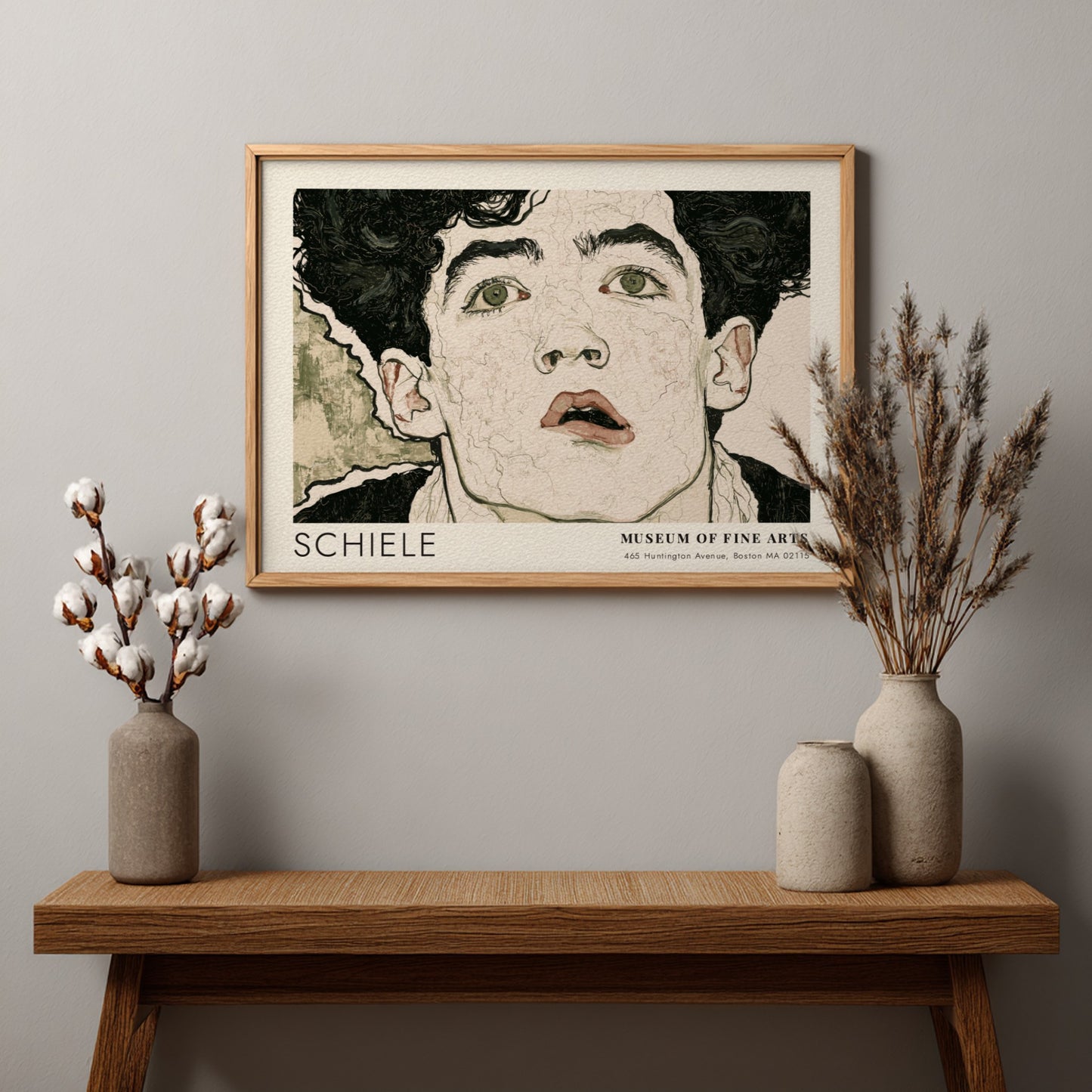 Wall art poster of an Egon Schiele portrait with dark hair and intense eyes.
