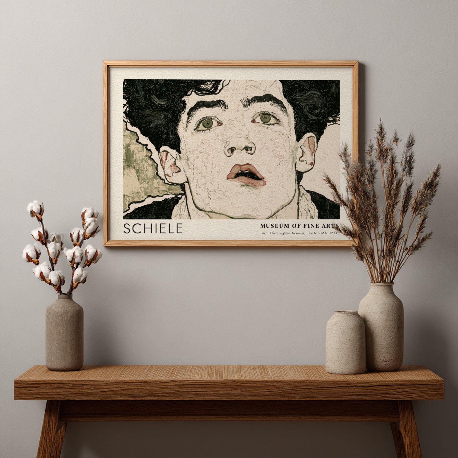 Wall art poster of an Egon Schiele portrait with dark hair and intense eyes.