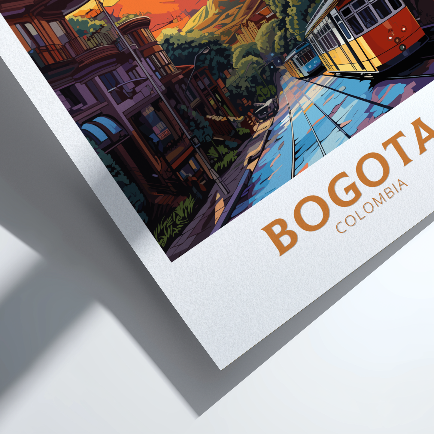 Framed artwork of a street scene in Bogota, Colombia with a trolley and colorful buildings.
