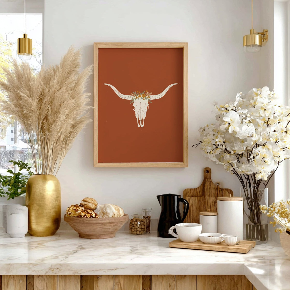 Poster featuring a white bull skull with a wildflower crown on terracotta background