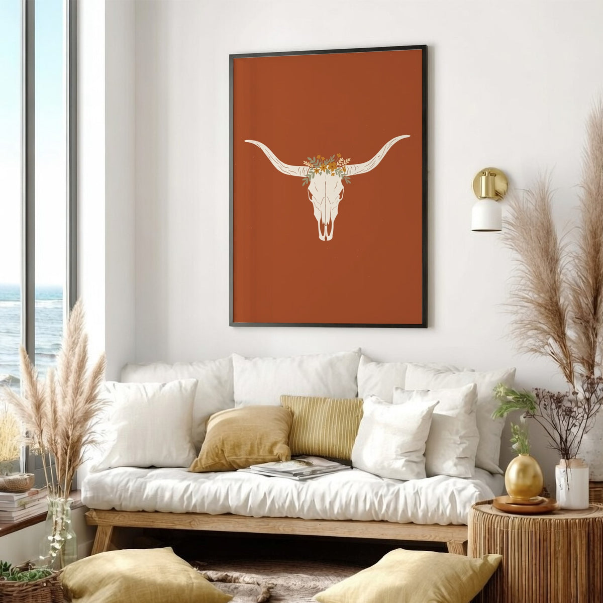Poster featuring a white bull skull with a wildflower crown on terracotta background