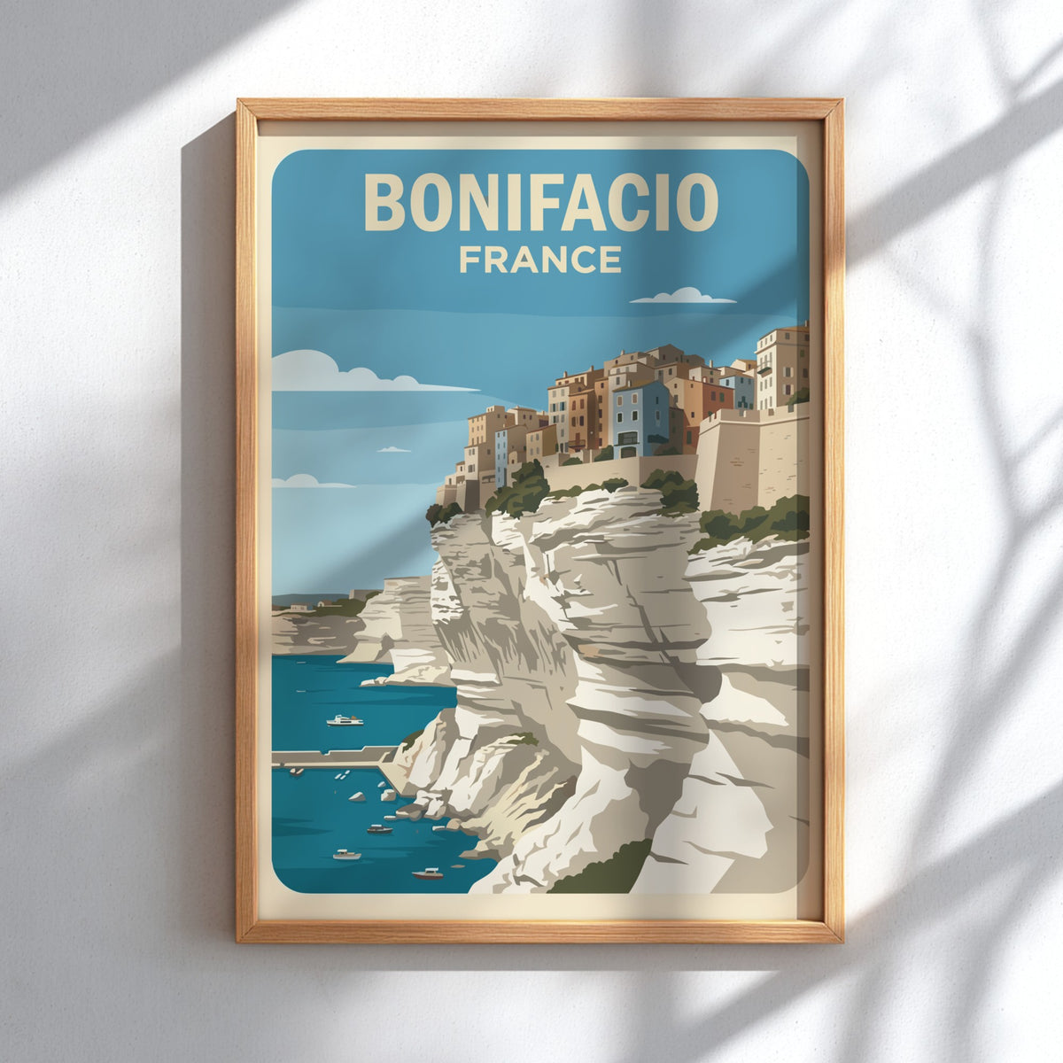 Poster of Bonifacio France featuring colourful buildings perched on steep white limestone cliffs above.