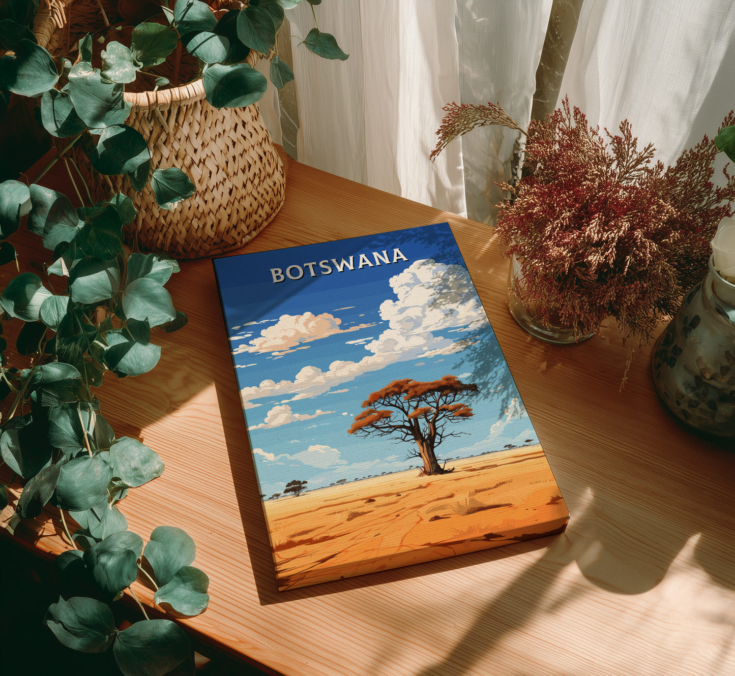 Book titled 'Botswana' on a wooden table with plants around