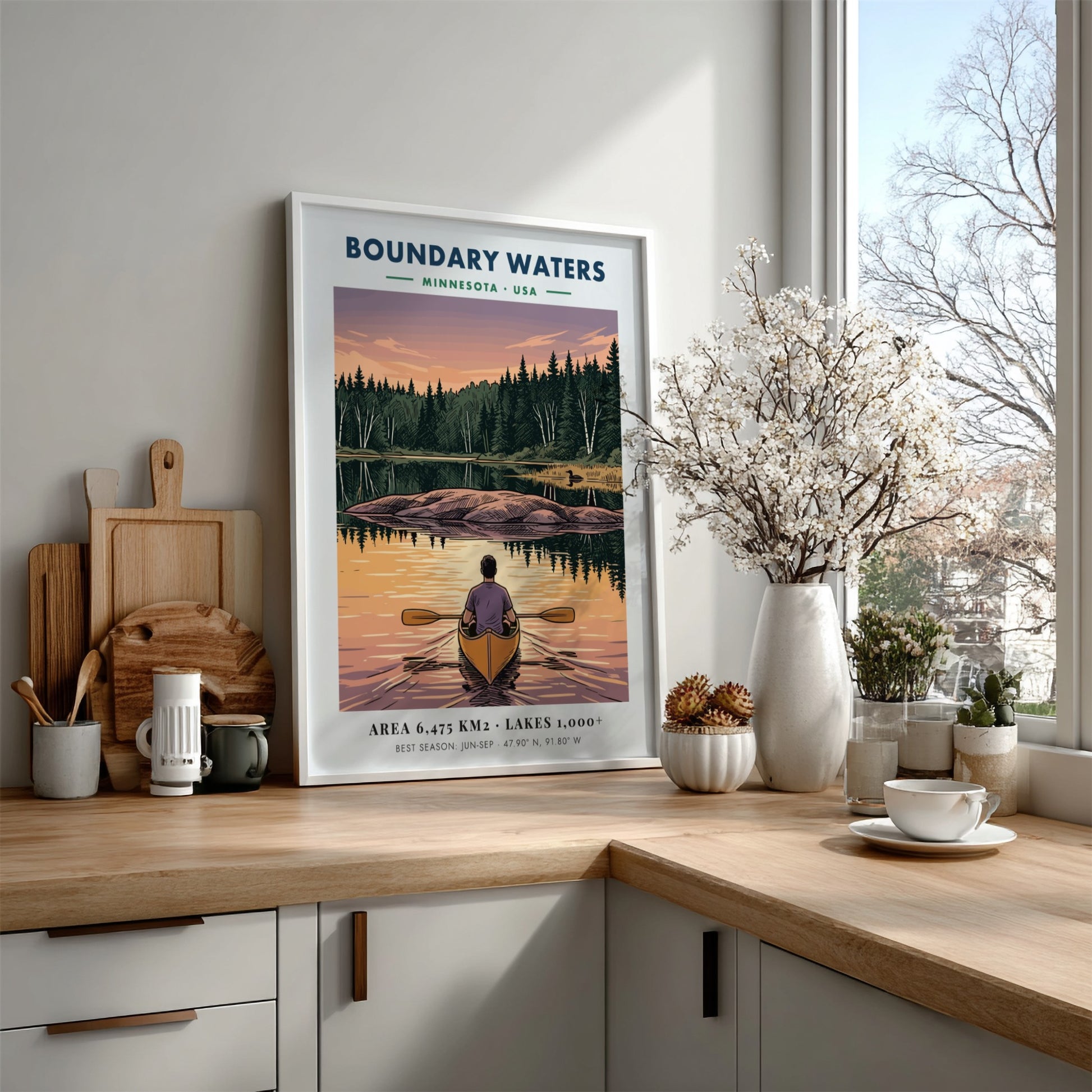 Poster of a lone kayaker paddling toward an island on Boundary Waters Minnesota lake.