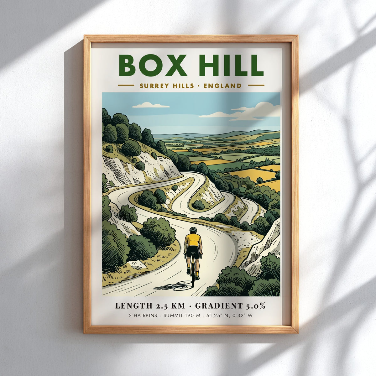 Poster of a cyclist climbing the winding roads of Box Hill in Surrey Hills.