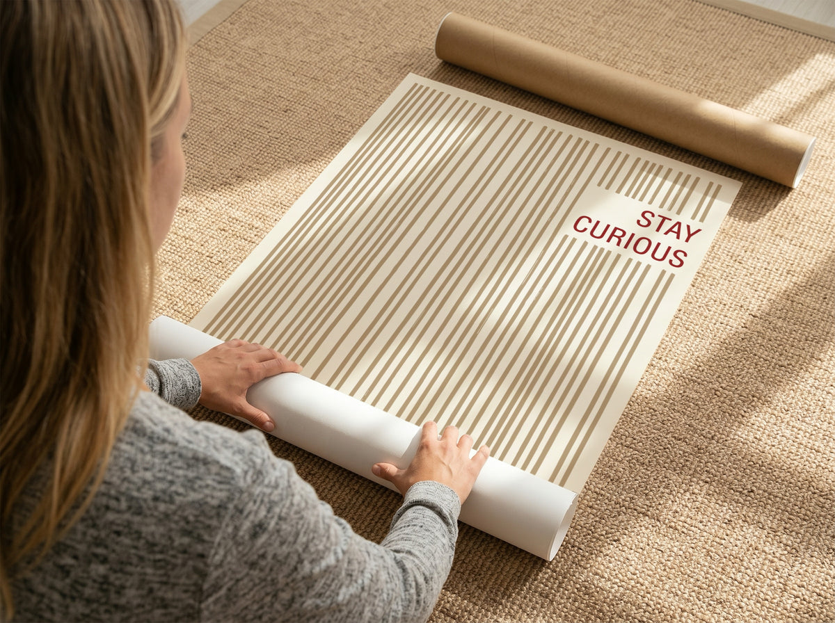 Motivational poster featuring vertical tan brushstrokes and the words Stay Curious in red.