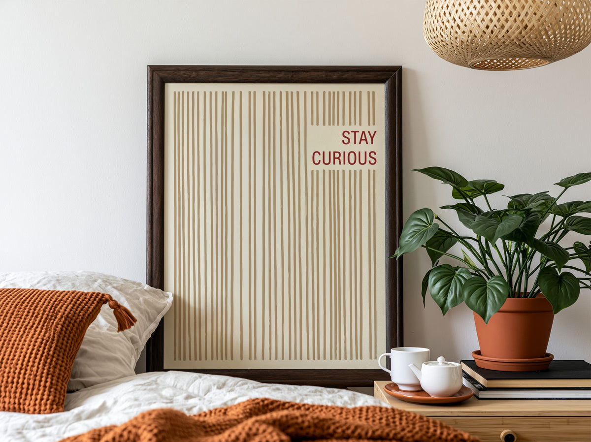 Motivational poster featuring vertical tan brushstrokes and the words Stay Curious in red.