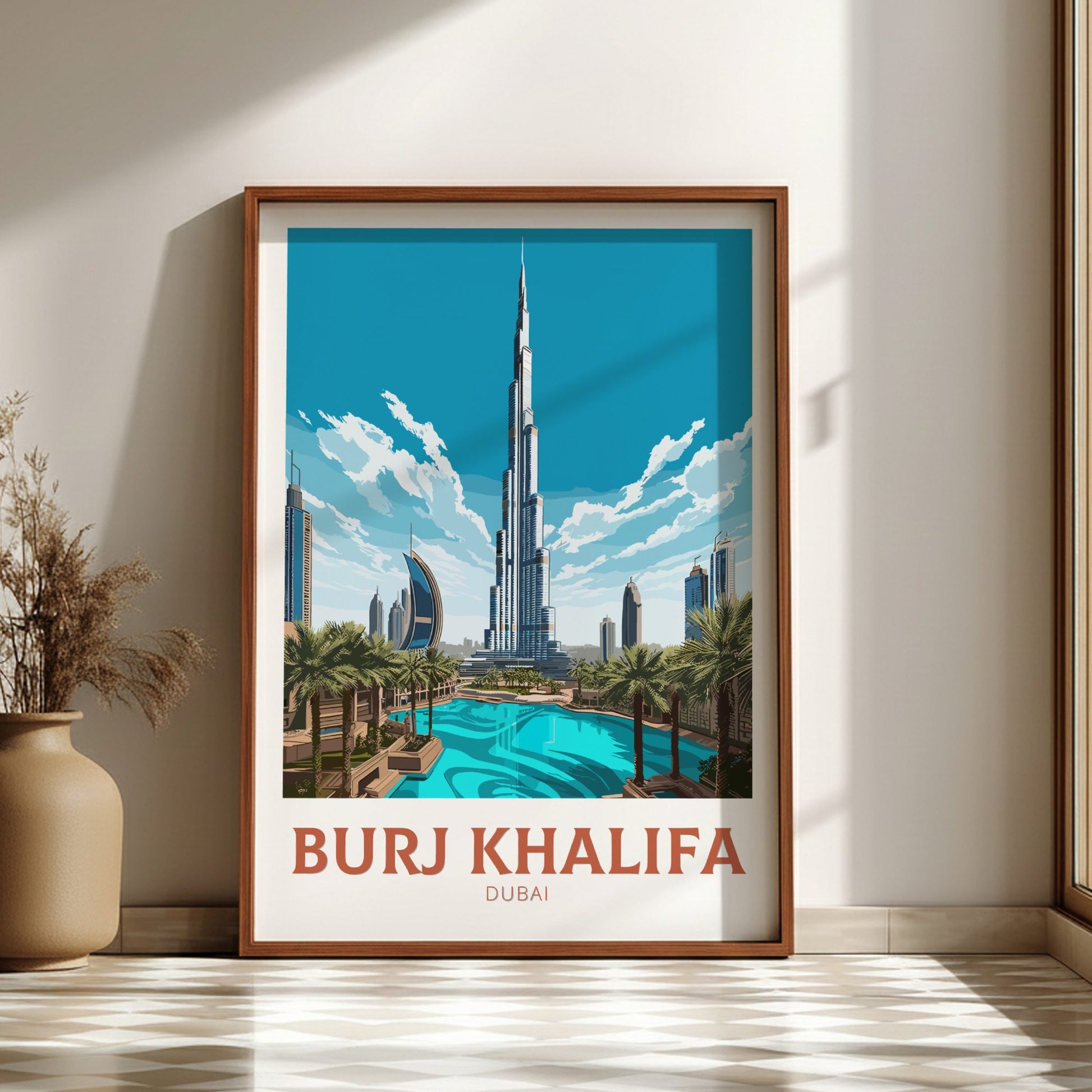 Framed poster of Burj Khalifa with a pool and palm trees in a room setting.