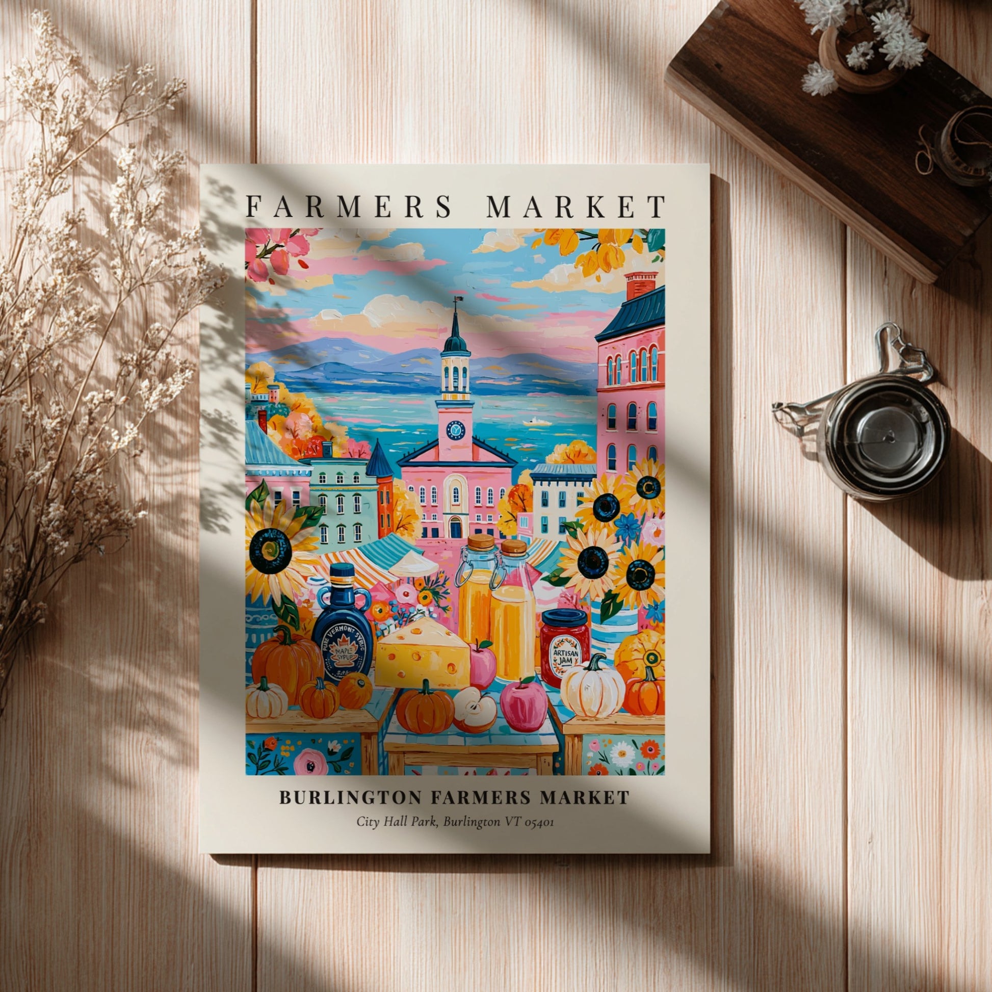 Burlington Farmers Market poster featuring colorful pumpkins and city backdrop in warm tones