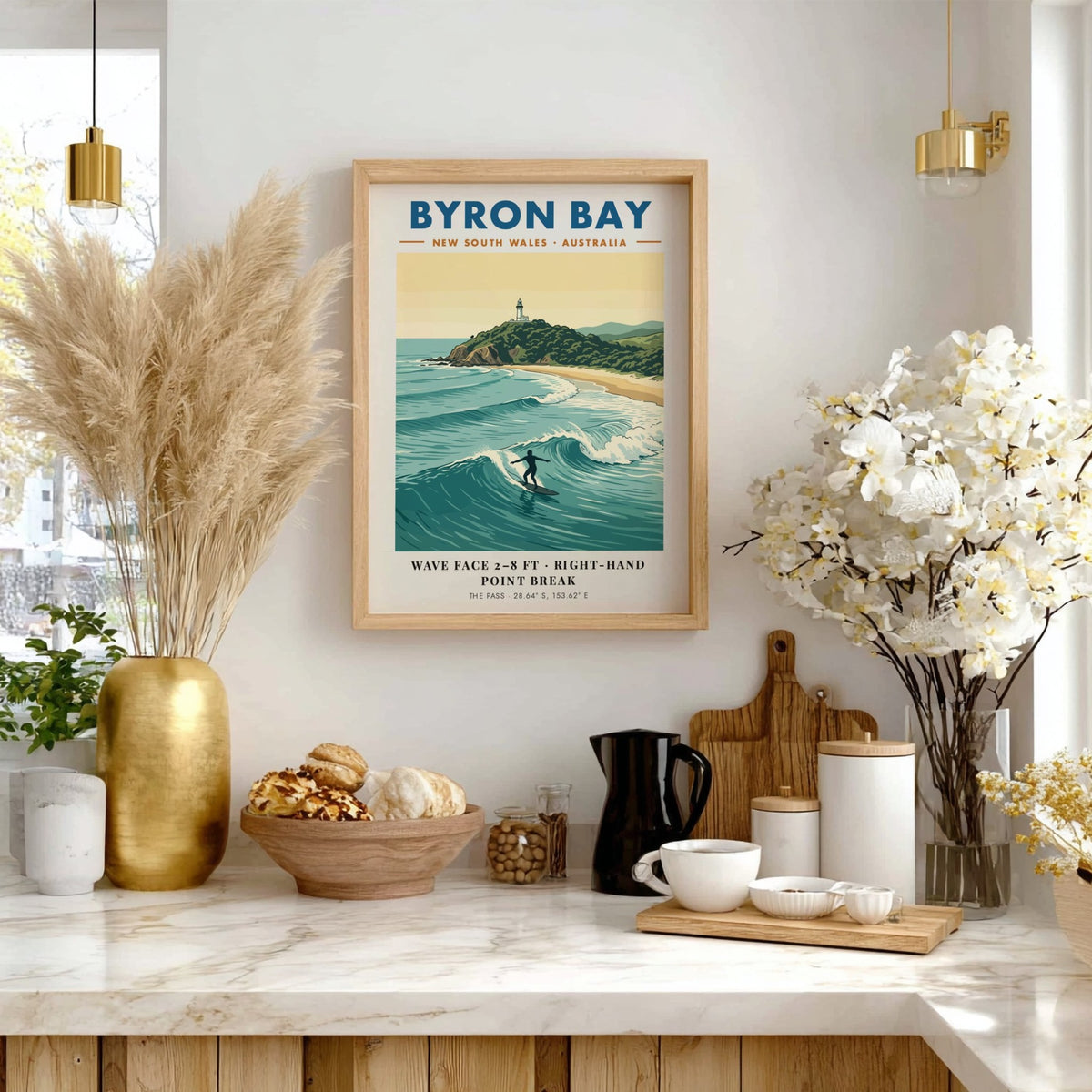 Poster featuring the Byron Bay lighthouse above a surfer riding a blue wave.