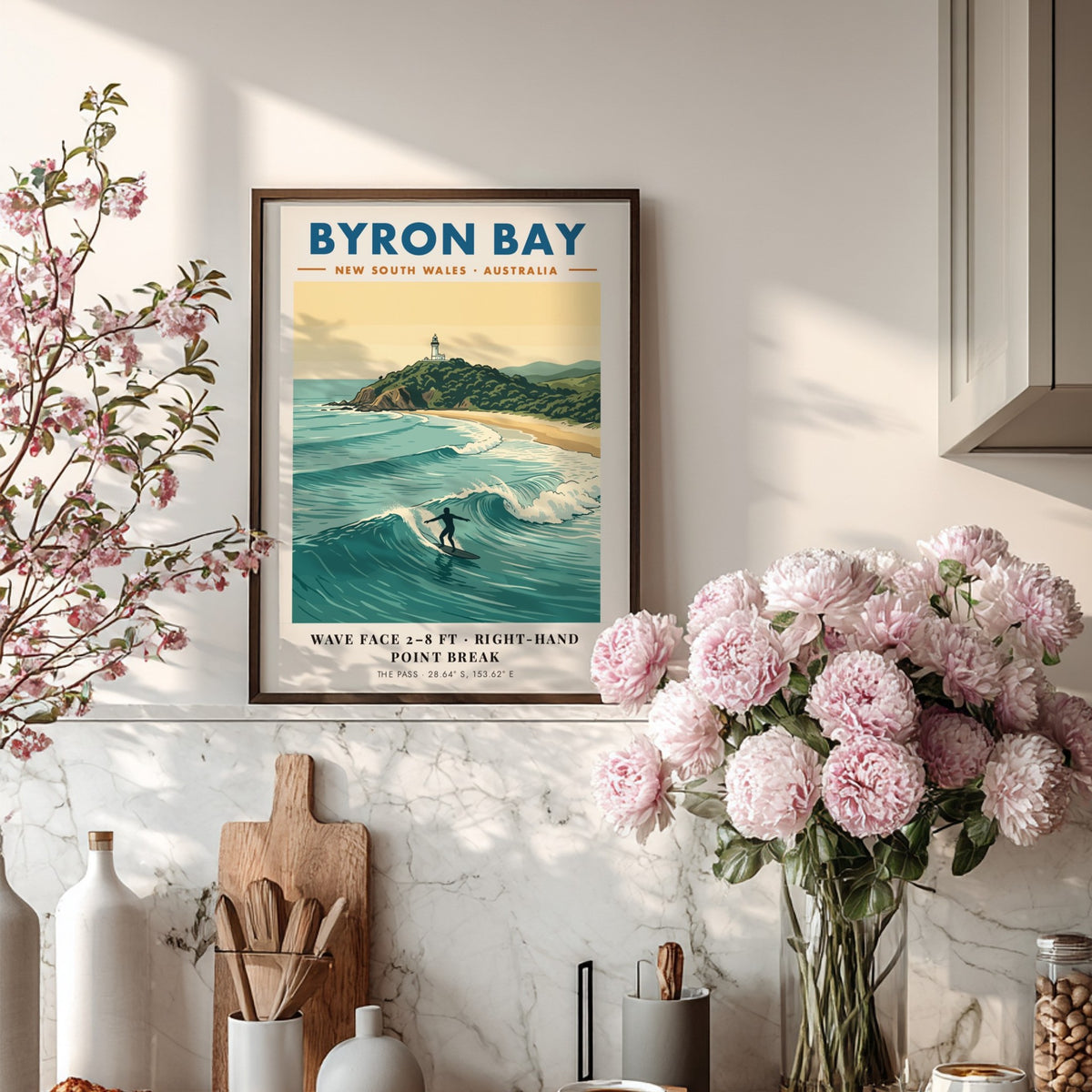 Poster featuring the Byron Bay lighthouse above a surfer riding a blue wave.