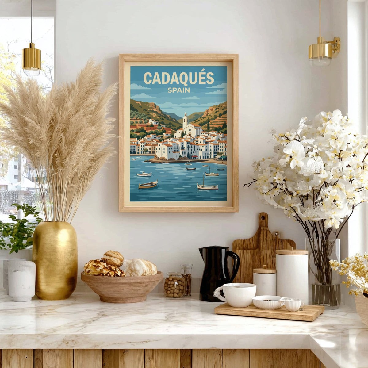 Poster of Cadaqués Spain featuring white buildings, a church, and boats on water.