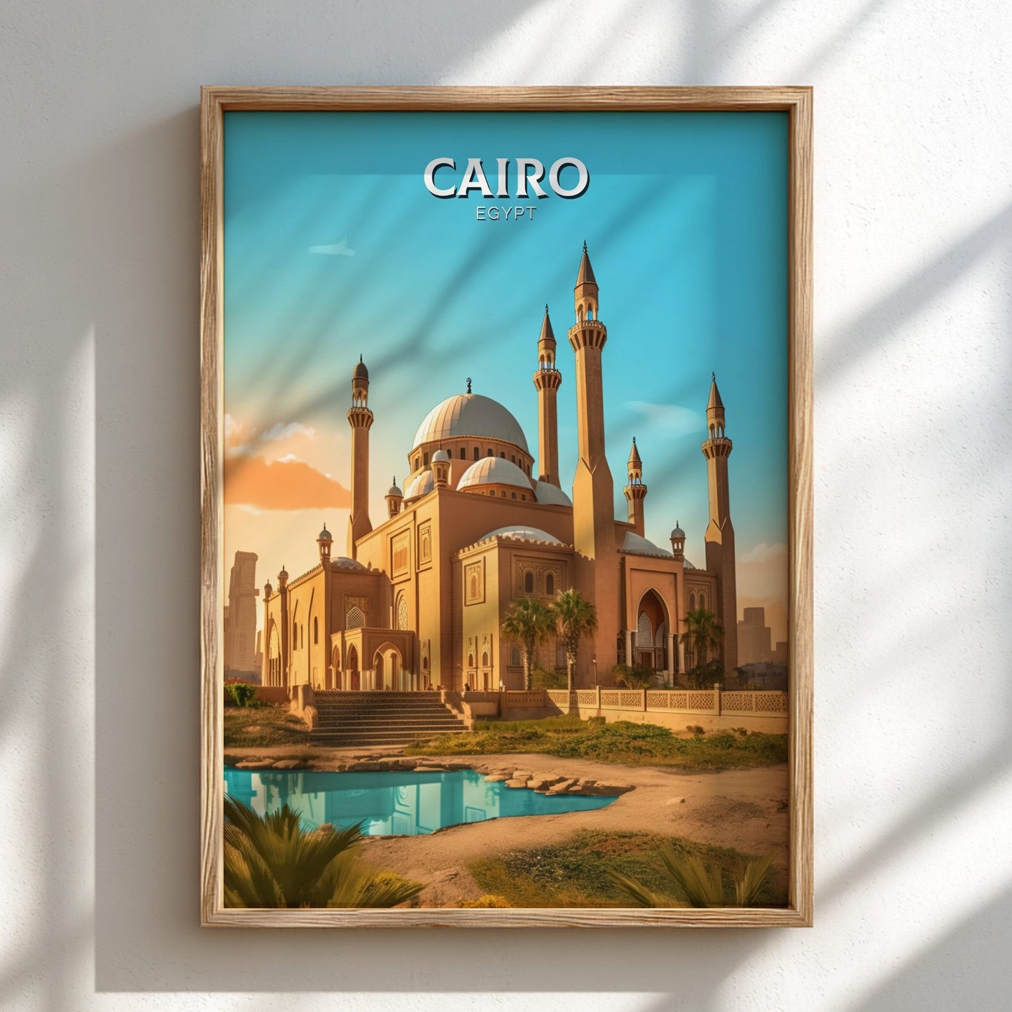 Framed poster of a mosque in Cairo with 'CAIRO' text on a blue sky background.