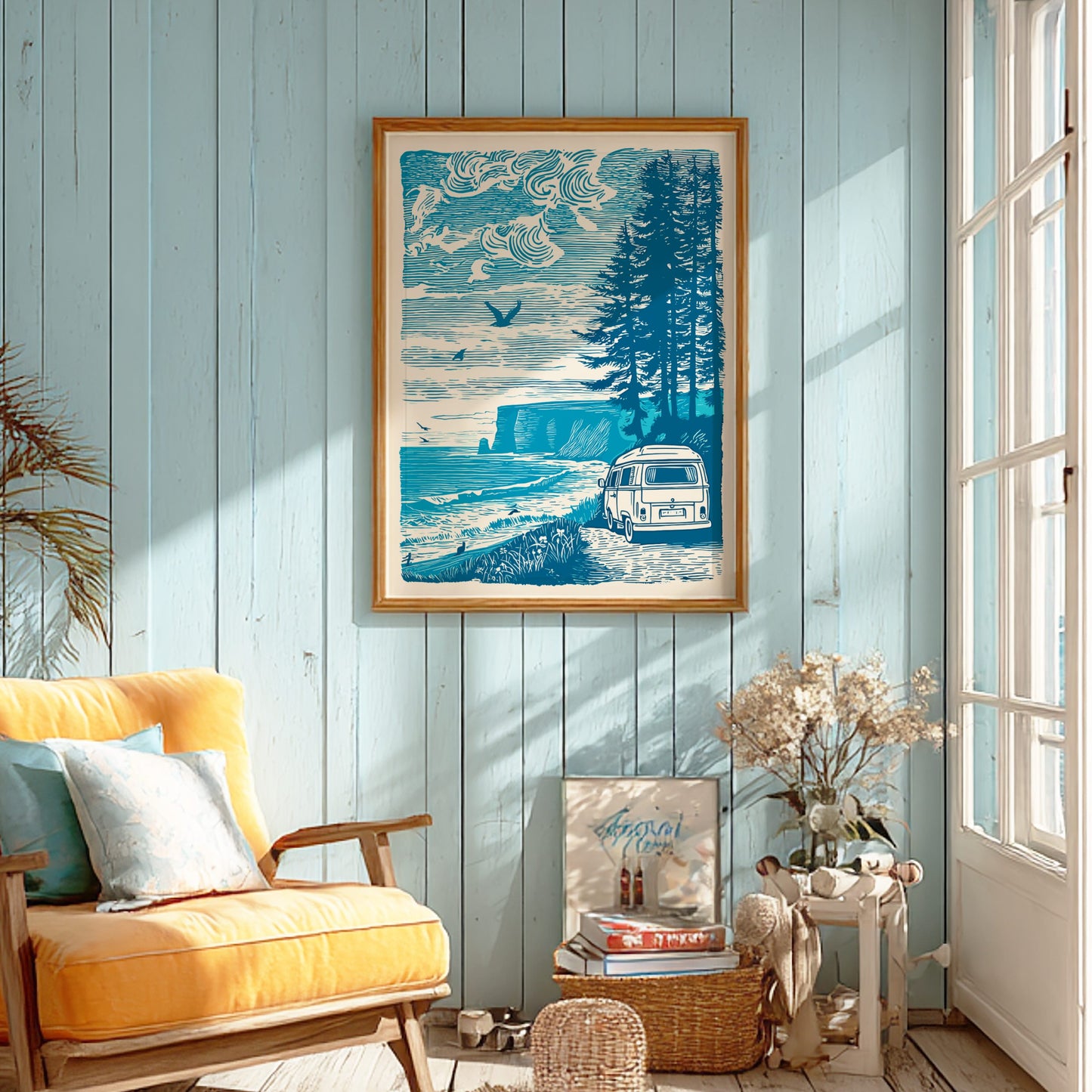 Living room with a yellow armchair, framed artwork of a forest and camper van, and a window letting in natural light.