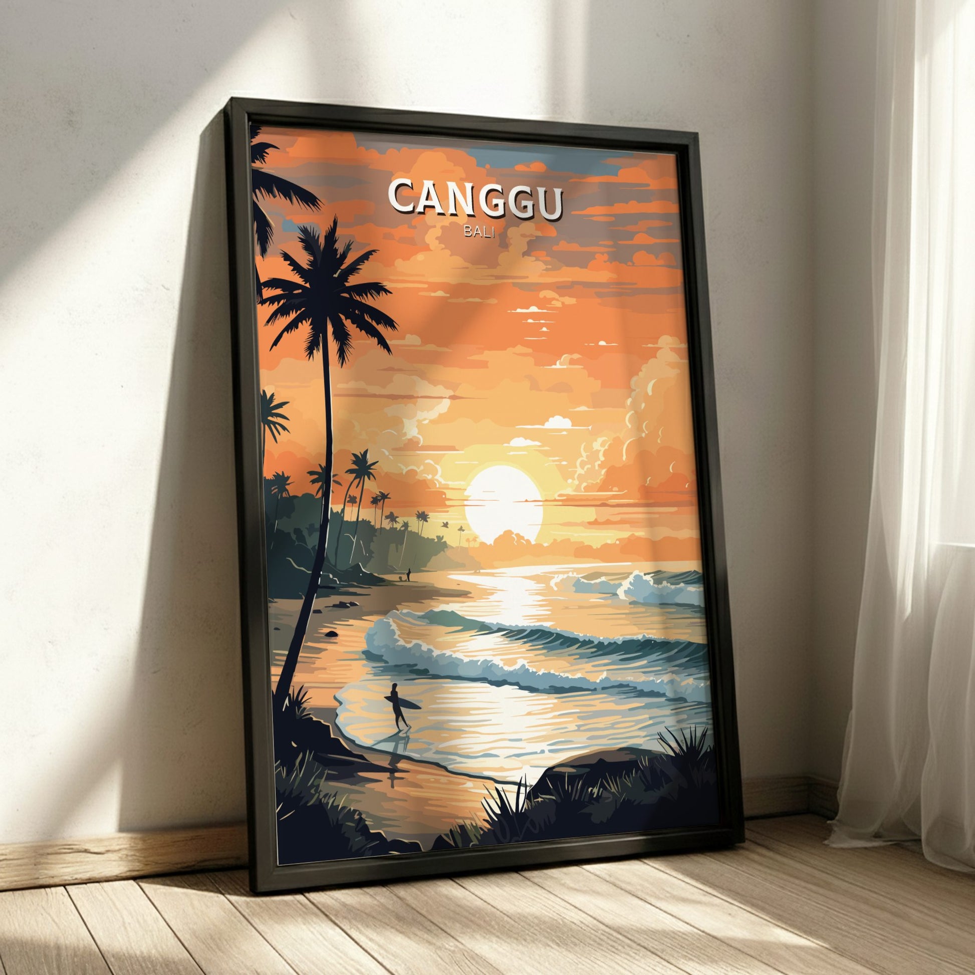 Framed artwork of a sunset over a beach with palm trees, titled 'Canggu', on a wall.