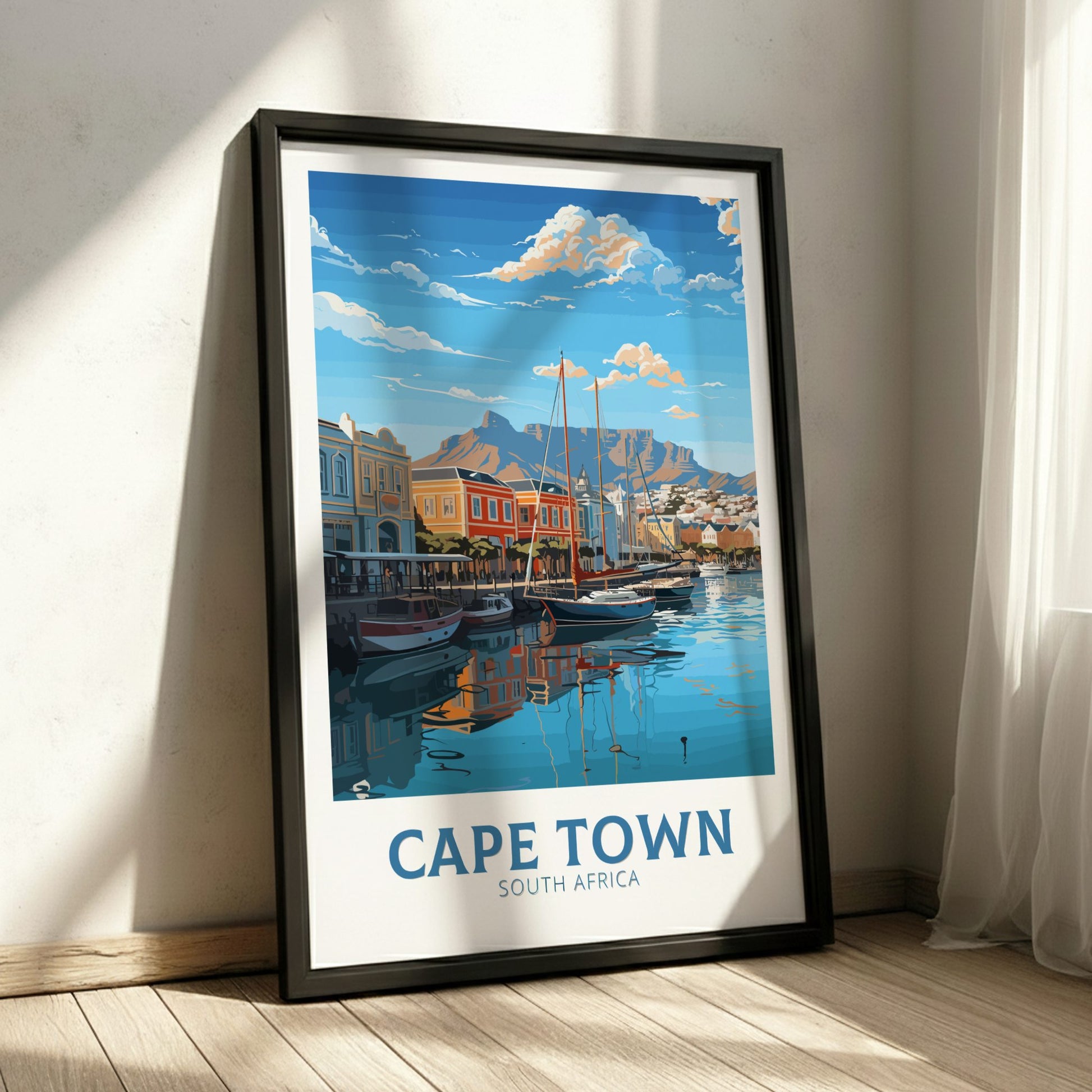 Framed artwork of Cape Town, South Africa, with a scenic view of boats and buildings.