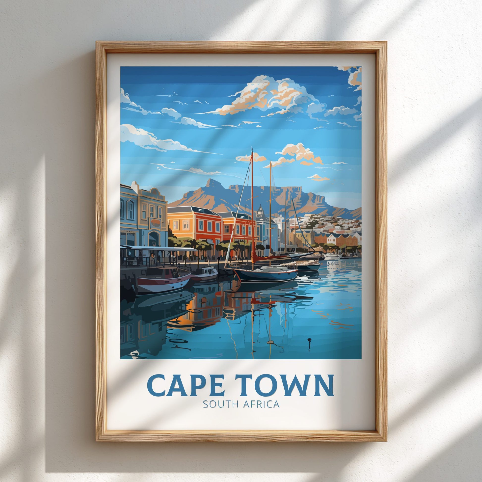 Framed artwork of Cape Town, South Africa with a harbor scene.