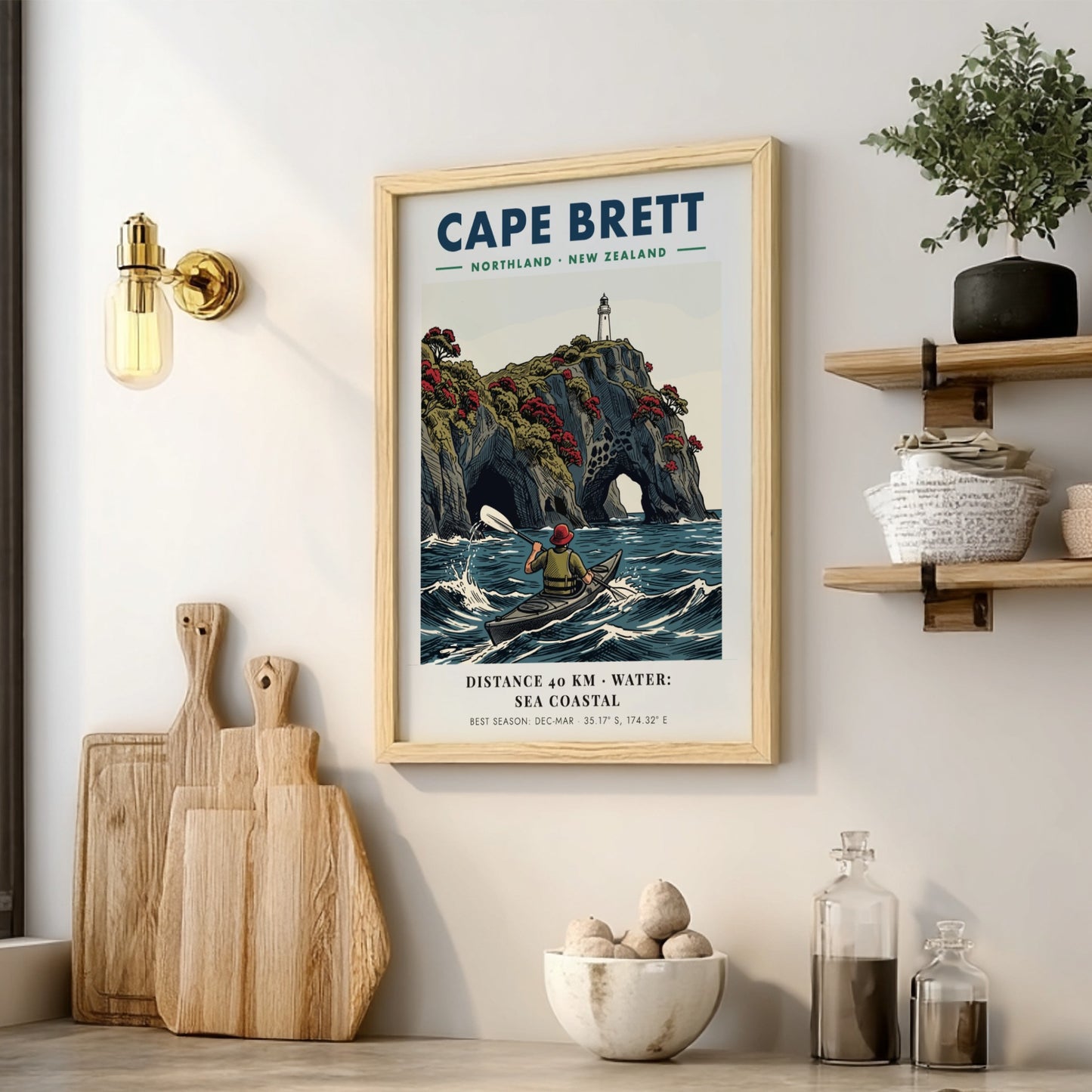 Poster of a kayaker paddling near the dramatic cliffs and lighthouse at Cape Brett.
