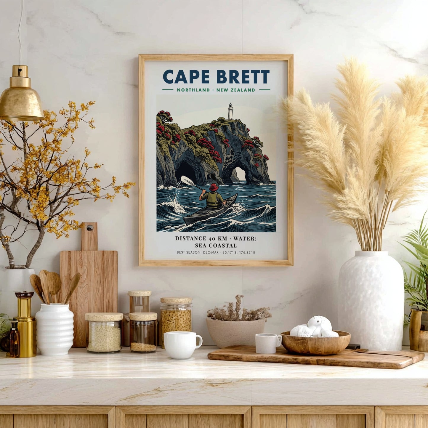 Poster of a kayaker paddling near the dramatic cliffs and lighthouse at Cape Brett.