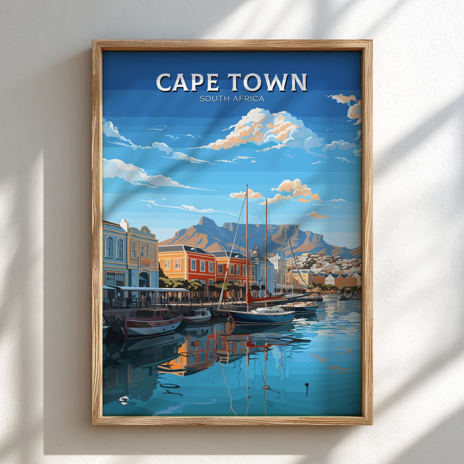 Framed artwork of Cape Town, South Africa with a harbor scene.