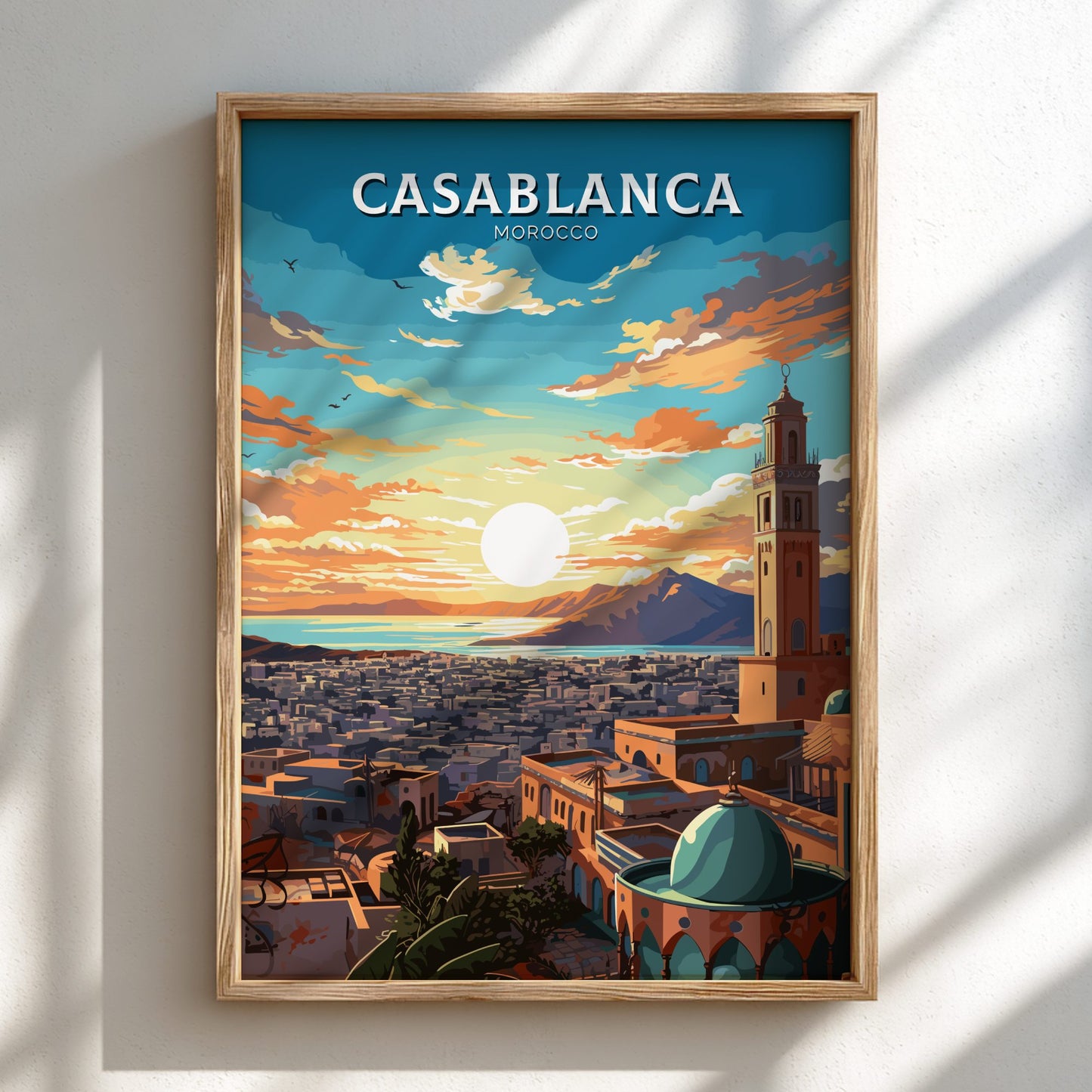 Framed artwork of Casablanca, Morocco with a sunset over the city.