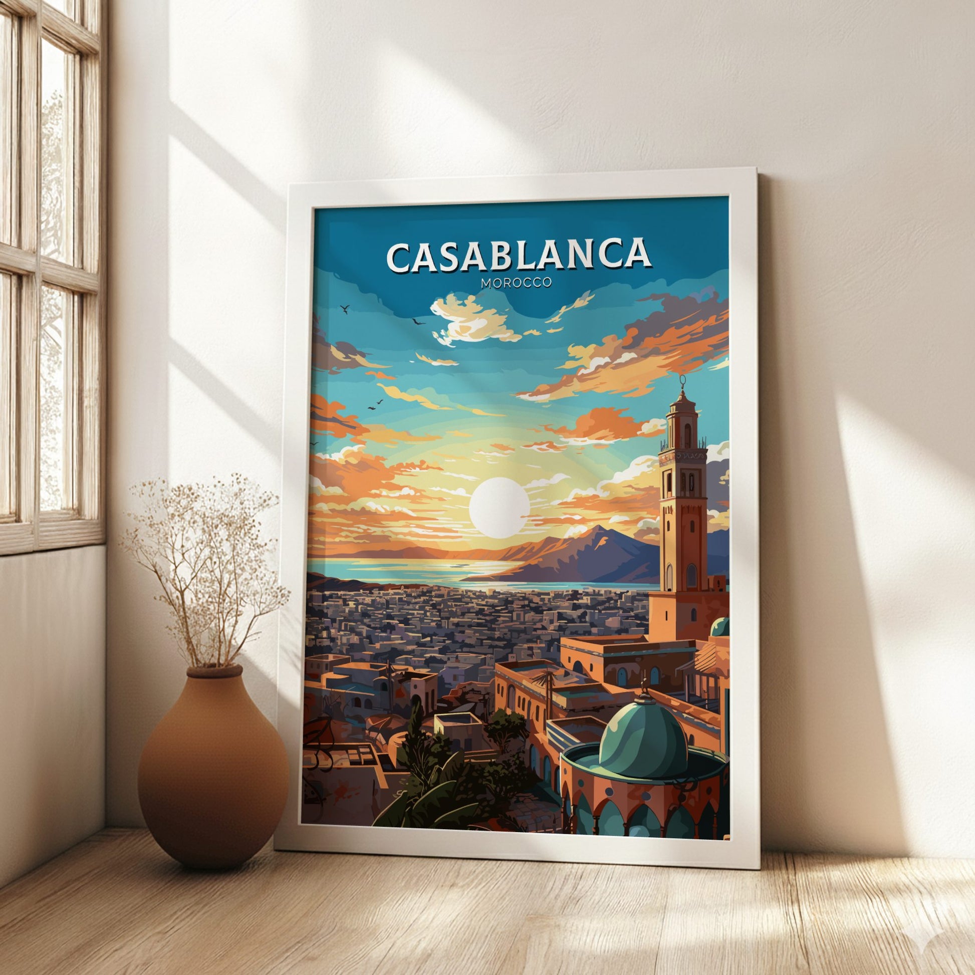 Framed poster of Casablanca, Morocco with a scenic view in a room with a vase and plant.