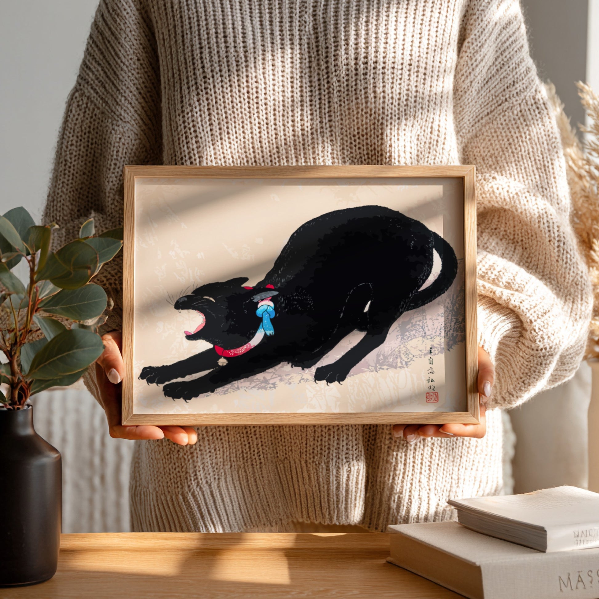 Japanese art print of a black cat yawning, by Hiroaki Takahashi, with red and blue collar.
