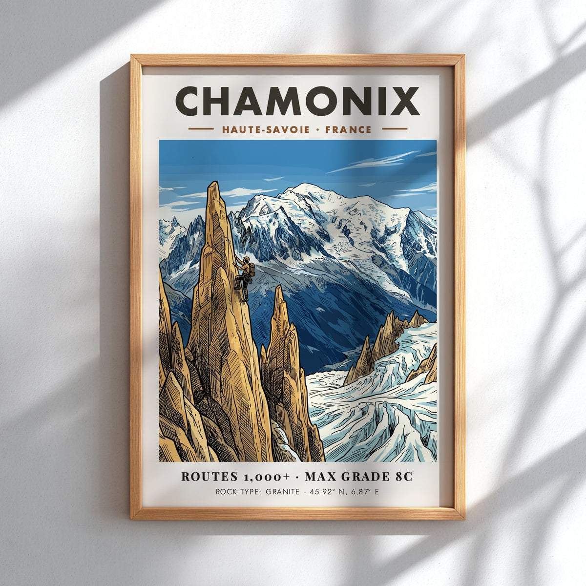 Poster of a climber scaling a granite peak in Chamonix with snowy mountains.