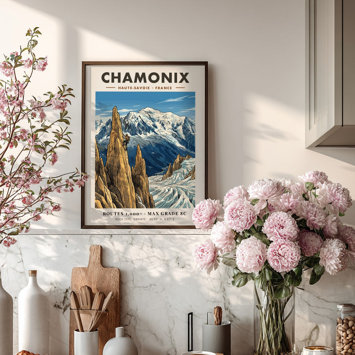 Poster of a climber scaling a granite peak in Chamonix with snowy mountains.