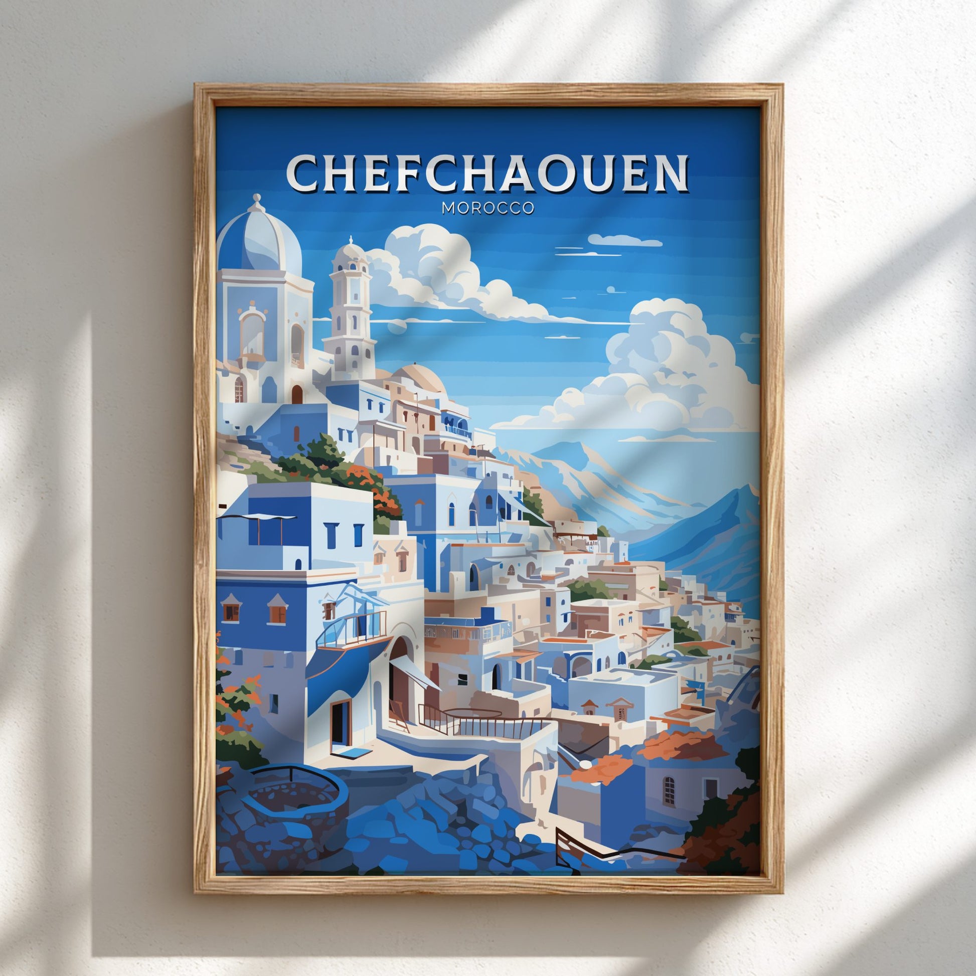 Framed artwork of Chefchaouen, Morocco with blue and white buildings.