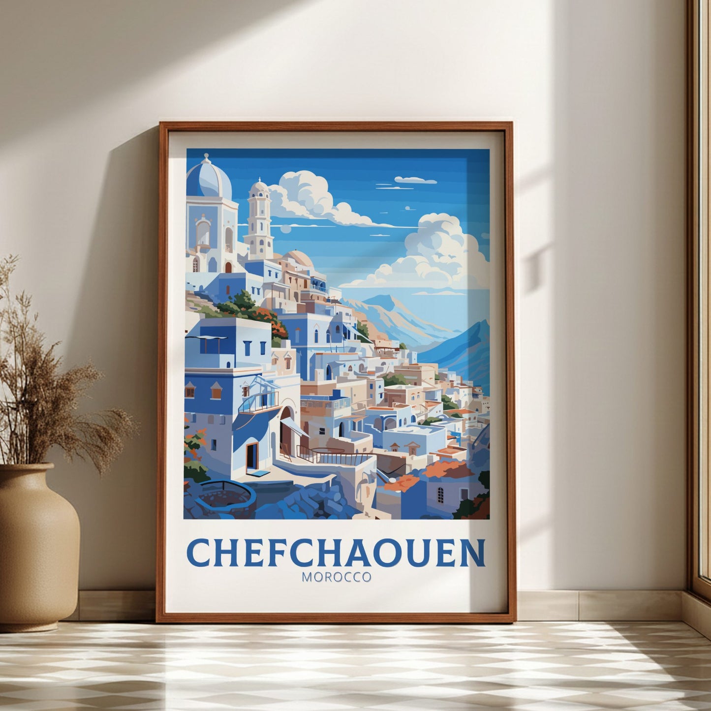 Framed artwork of Chefchaouen, Morocco with a wooden frame on a wall.