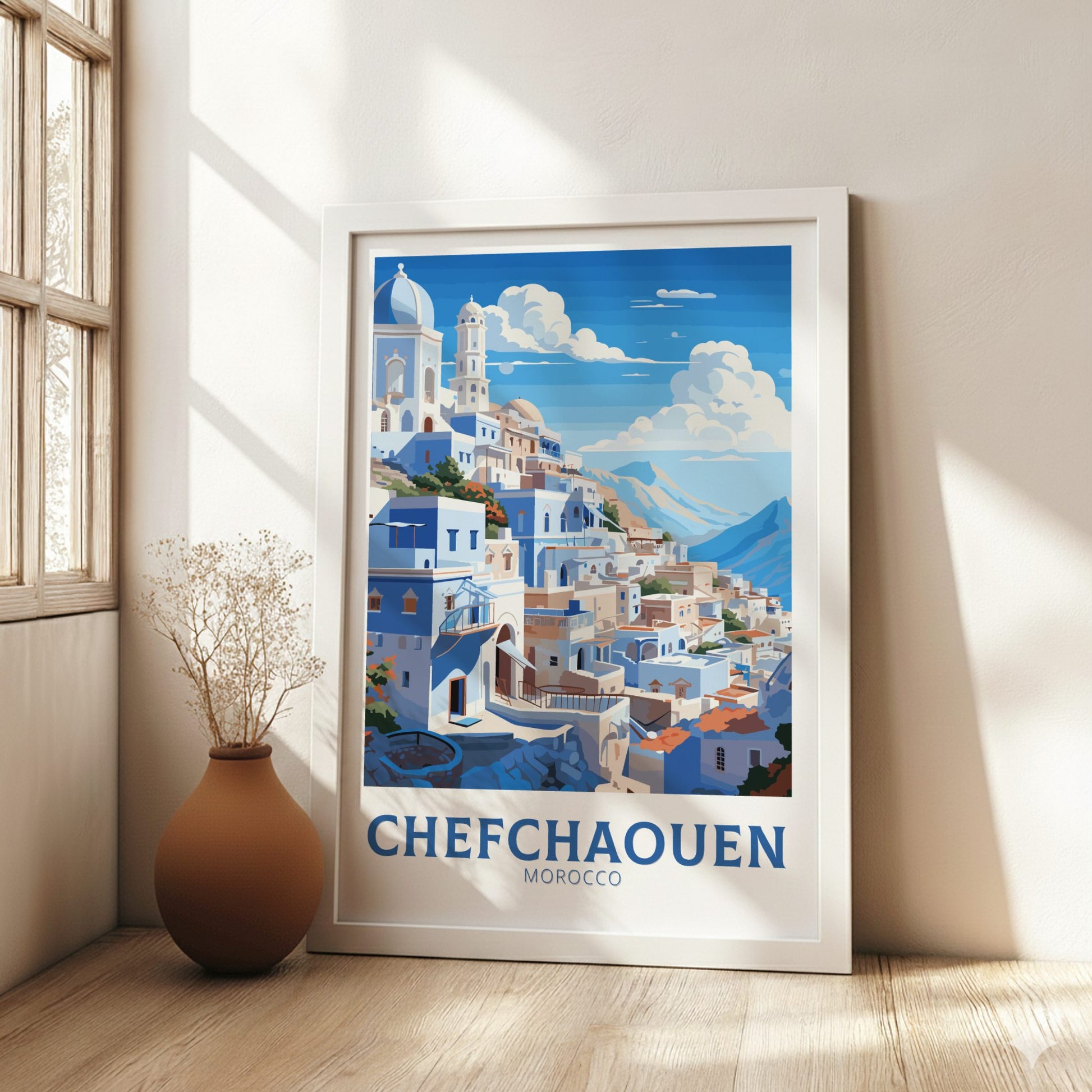 Framed artwork of Chefchaouen, Morocco with a wooden frame on a wall.