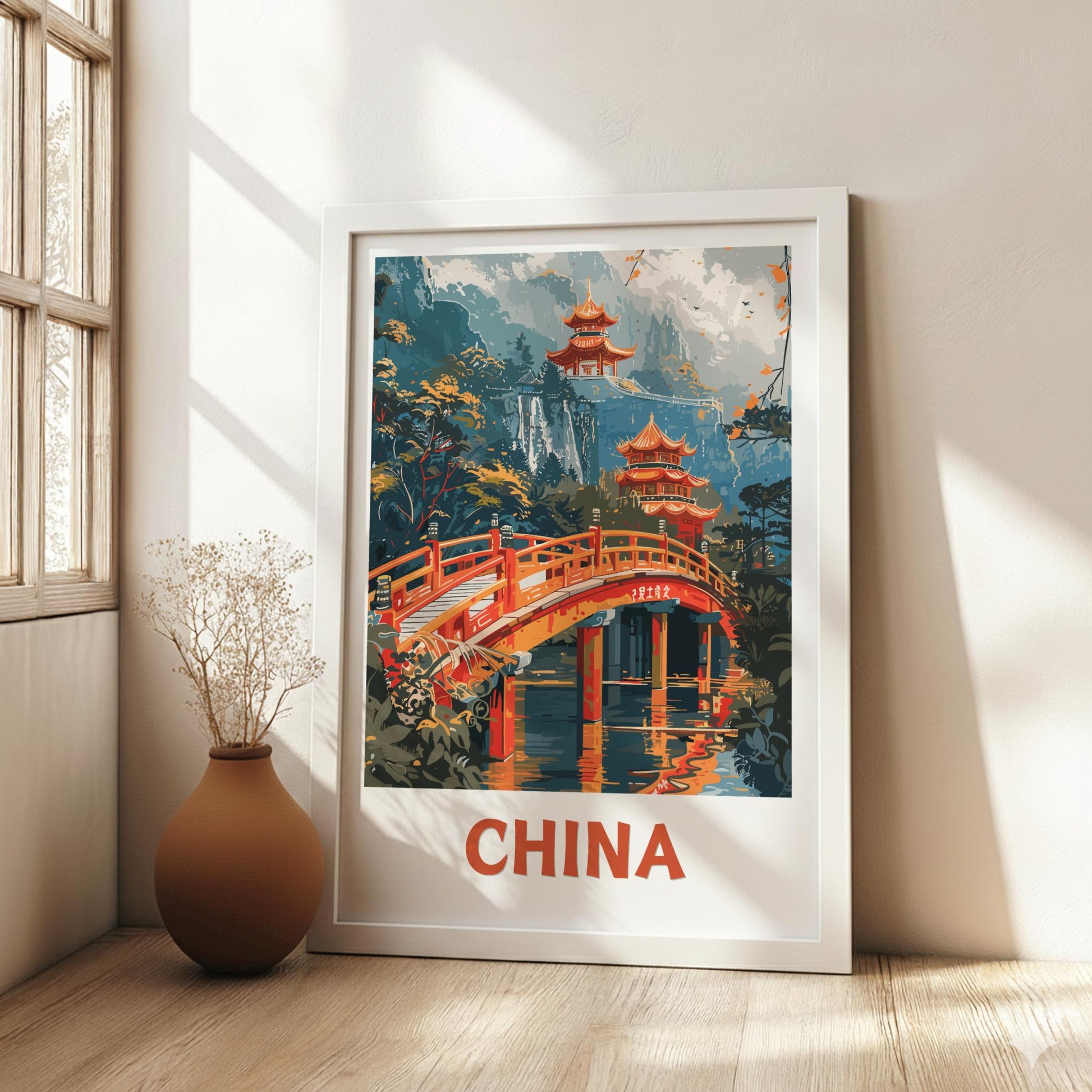 Framed artwork of a Chinese landscape with a bridge and pagoda, labeled 'China', in a room with a vase and window.