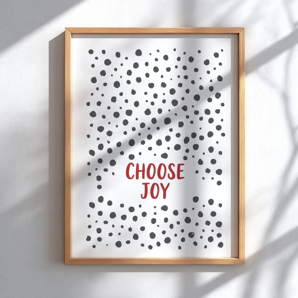 Motivational poster with Choose Joy text in red surrounded by grey polka dots