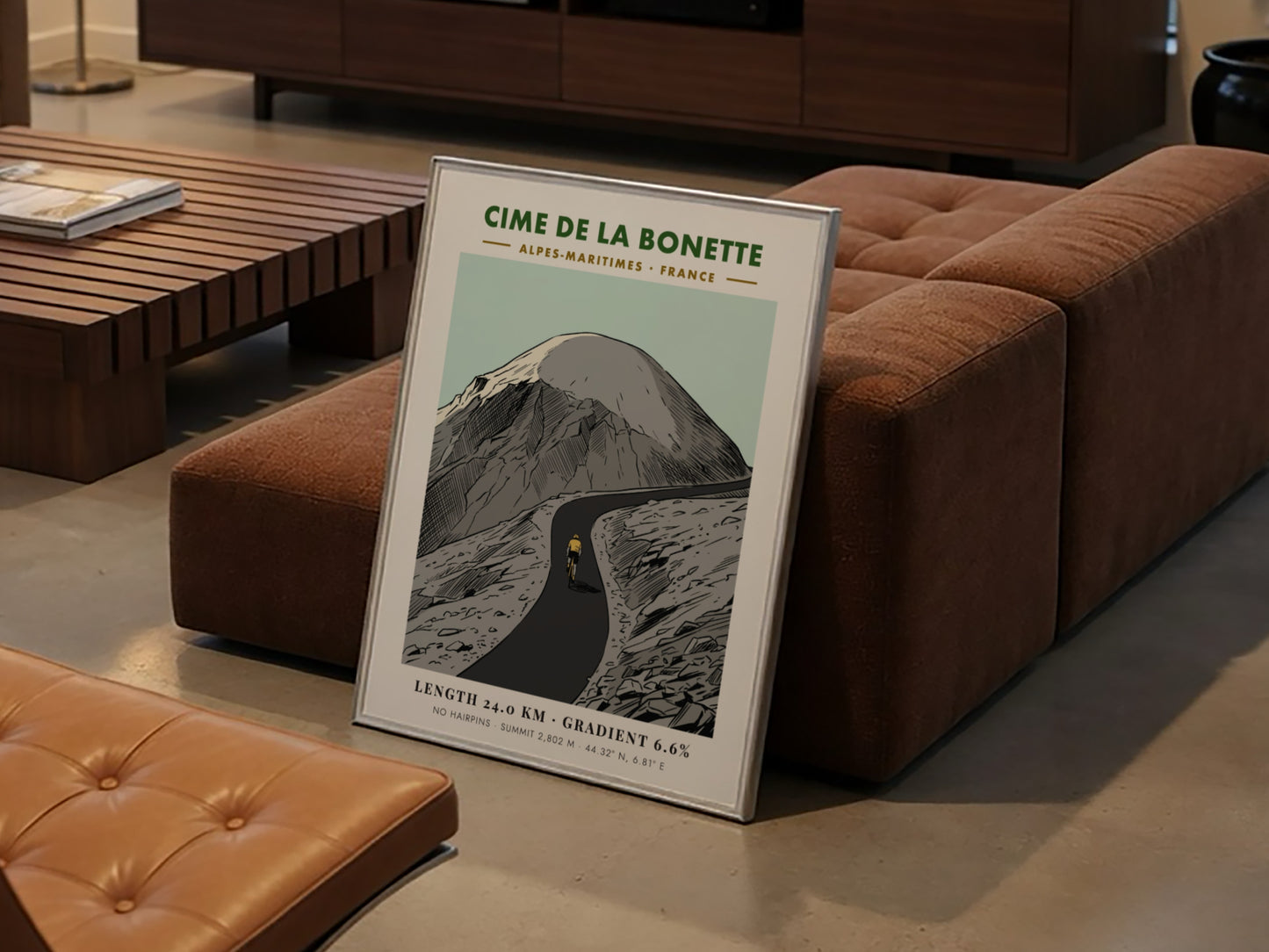 Poster of a lone cyclist riding up the winding Cime De La Bonette mountain.