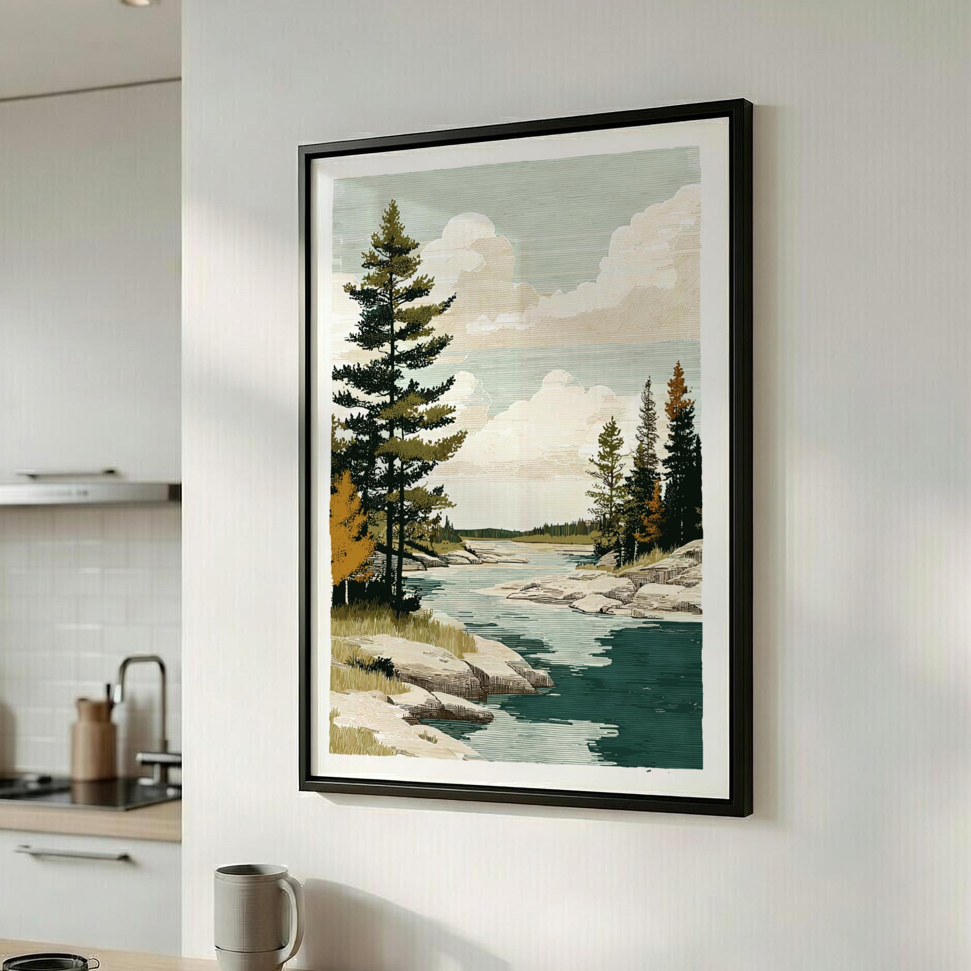 Framed landscape print of a river and trees on a wall in a kitchen.