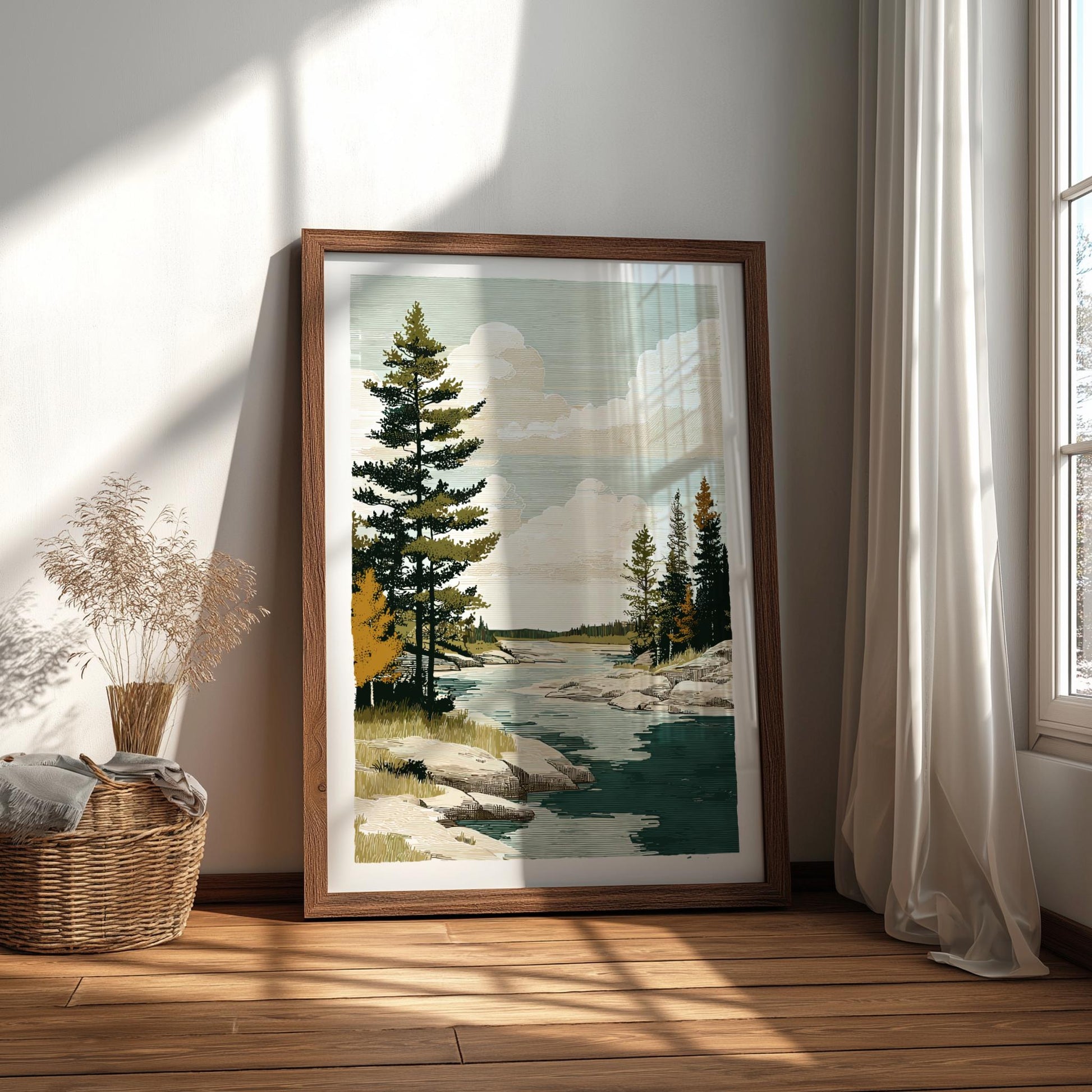 Framed nature print of a forest scene on a wall with sunlight casting shadows.