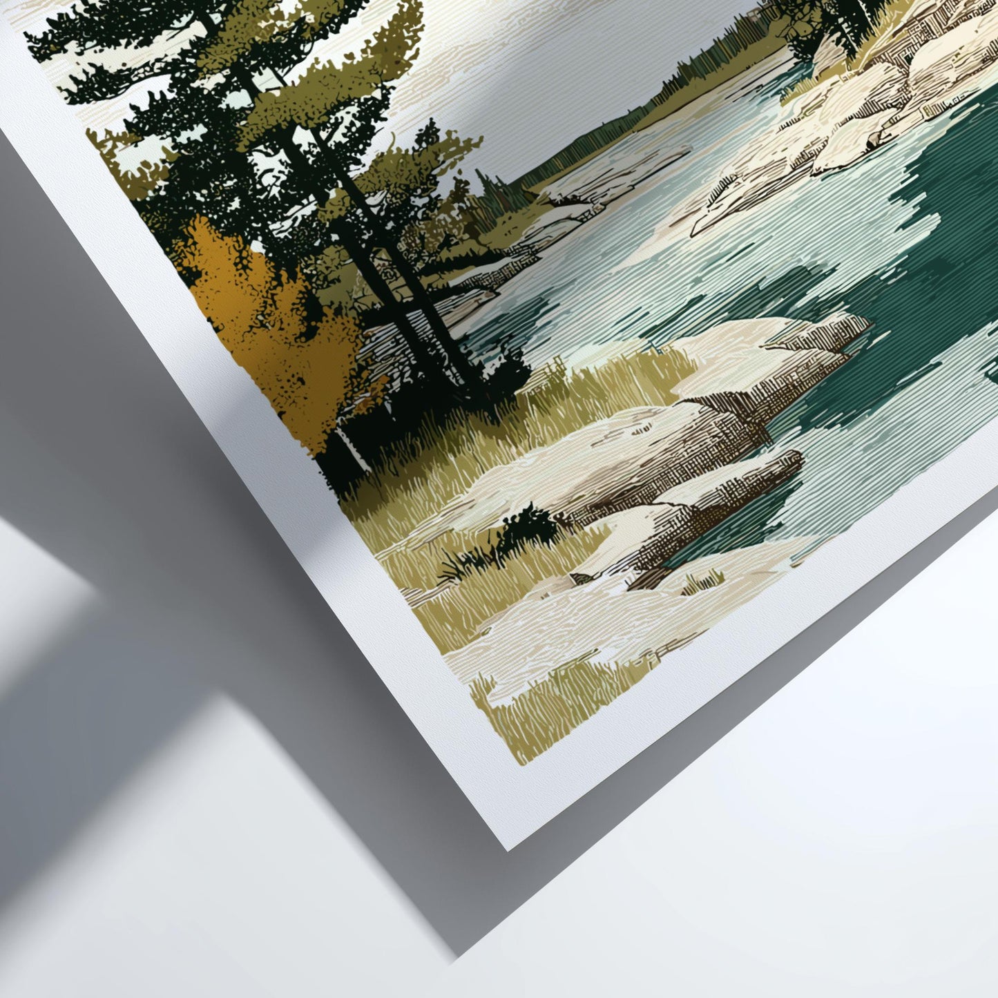 Close-up of a framed landscape print with trees, rocks, and water.