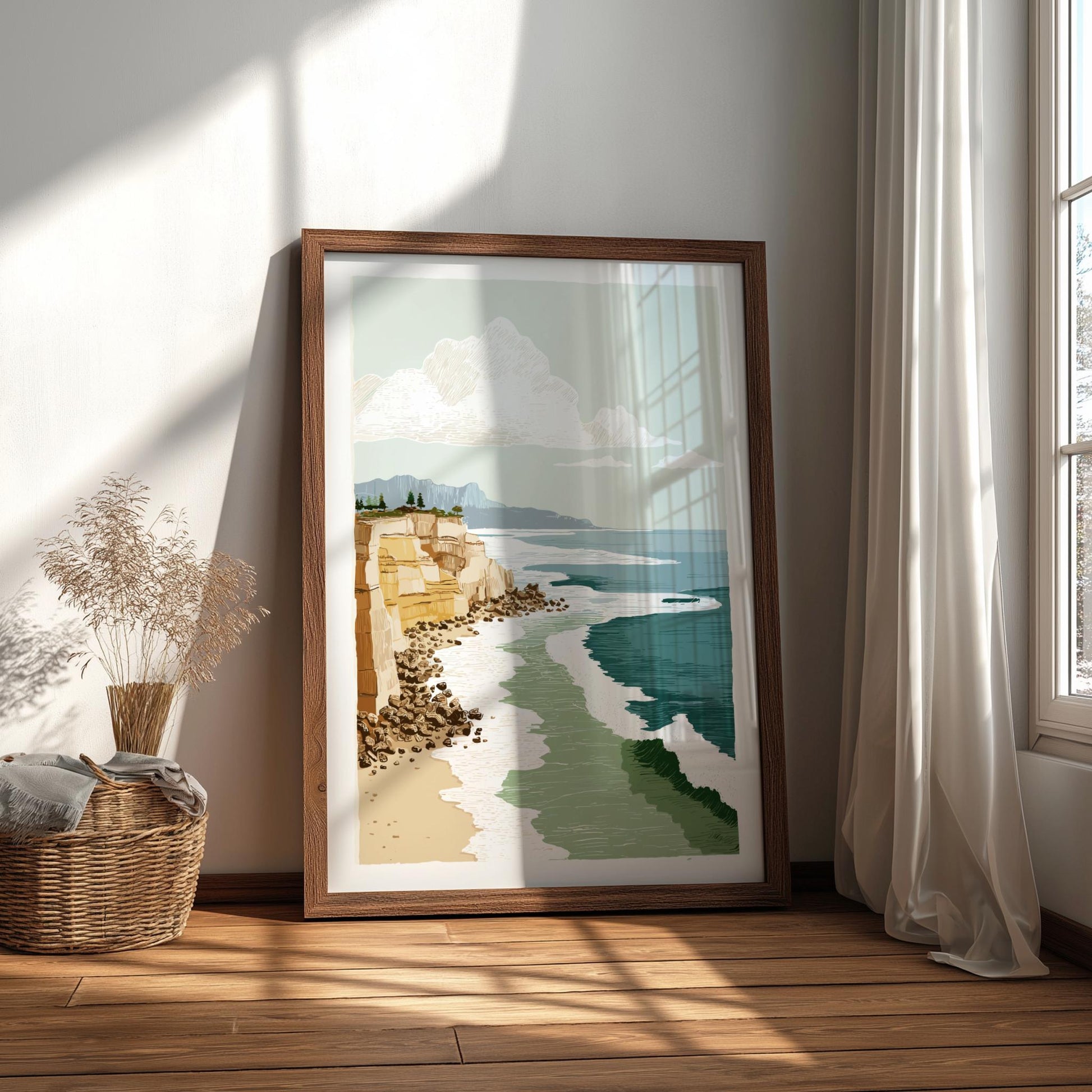 Framed artwork of a coastal scene on a wall in a bright room with natural light.