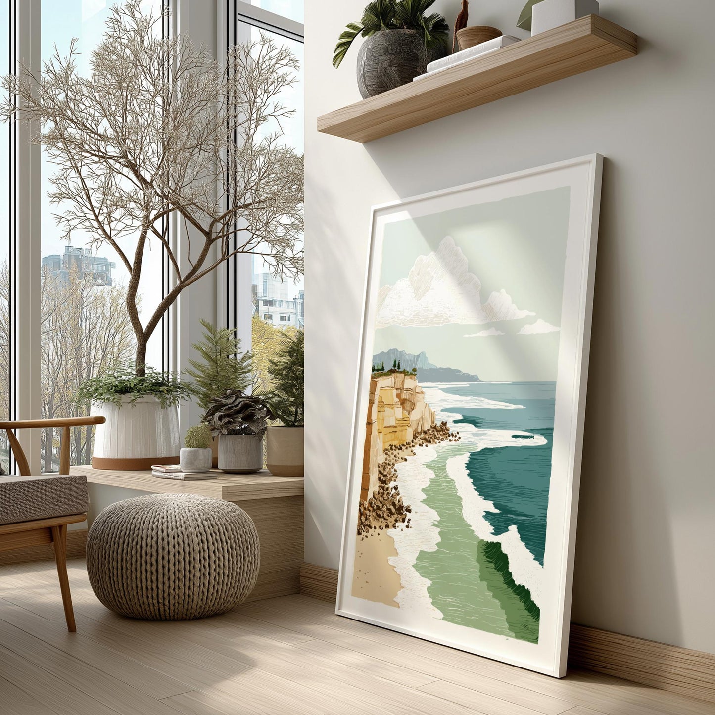 Framed artwork of a coastal scene in a modern living room with plants and a wooden shelf.